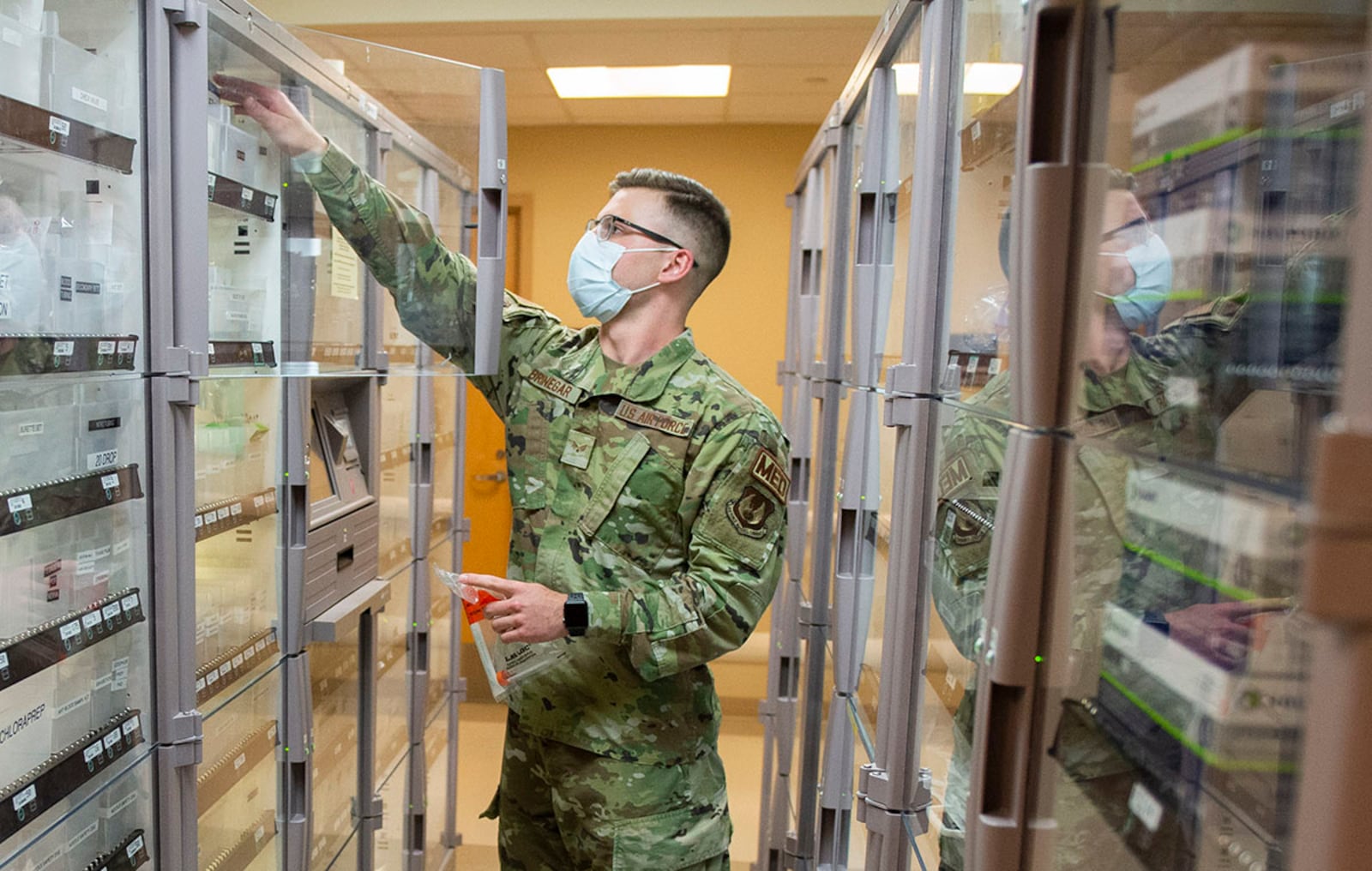 Senior Aiman Joshua Bringer, a medical technician with the 88th Medical Group, retrieves supplies in the emergency room of the Wright-Patterson Medical Center April 28. U.S. AIR FORCE PHOTO/WESLEY FARNSWORTH