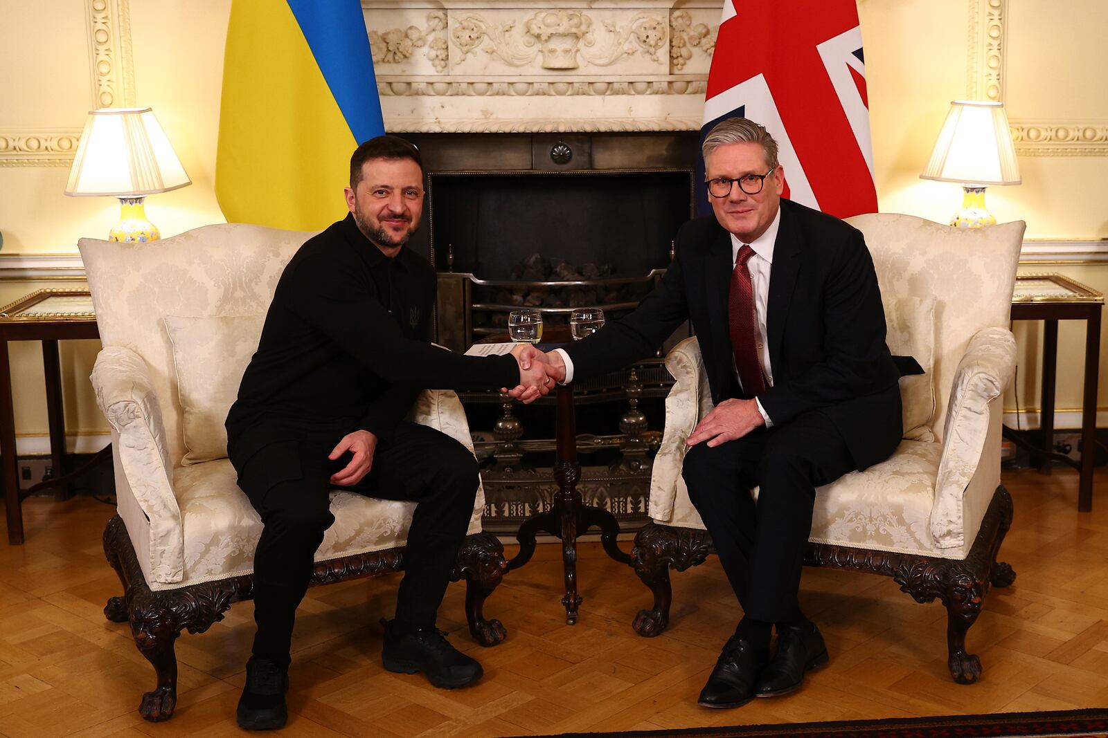 Britain's Prime Minister Keir Starmer, right, greets Ukraine's President Volodymyr Zelenskyy, left, for a meeting at 10 Downing Street in London, England, Saturday, March 1, 2025. (Peter Nicholls/Pool Photo via AP)