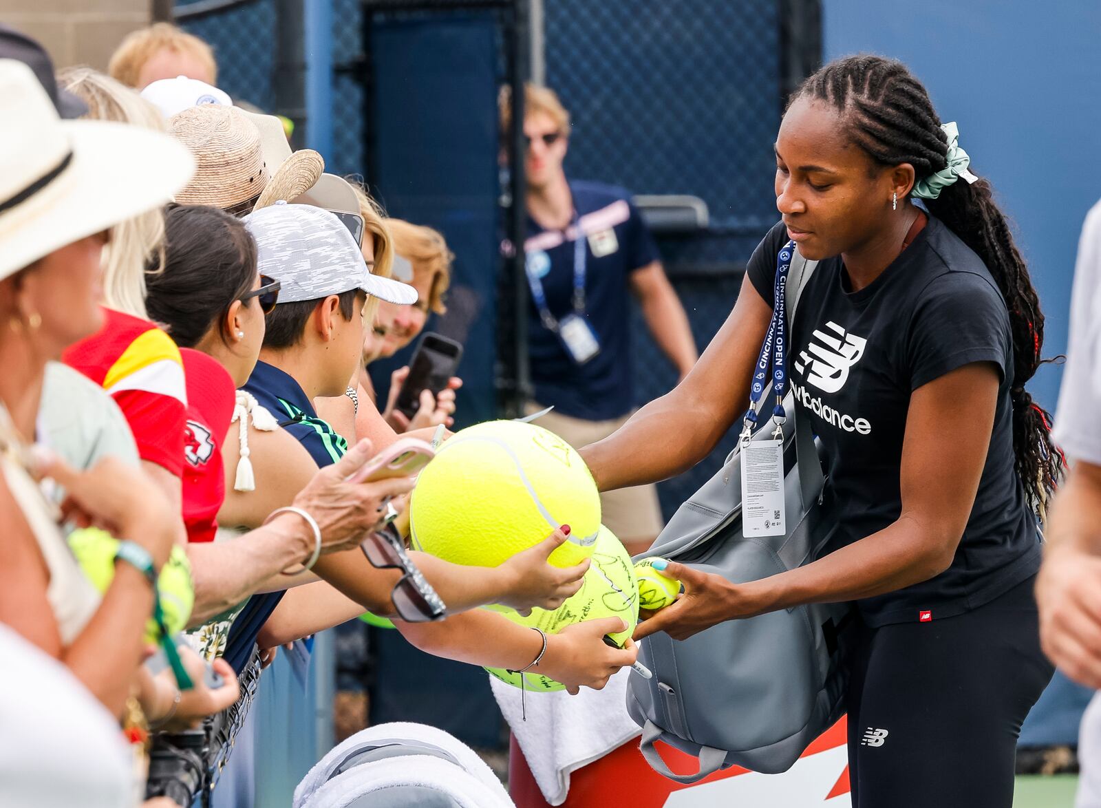 Coco Gauff signs autographs for fans after her practice session at Cincinnati Open tennis tournament Thursday, Aug. 15, 2024 at Lindner Family Tennis Center in Mason. 