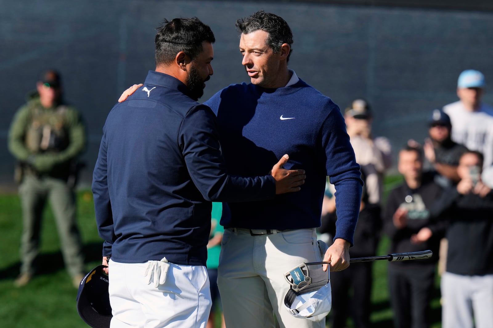 J.J. Spaun, left, greets Rory McIlroy, of Northern Ireland, after McIlroy won a playoff round of The Players Championship golf tournament Monday, March 17, 2025, in Ponte Vedra Beach, Fla. (AP Photo/Chris O'Meara)