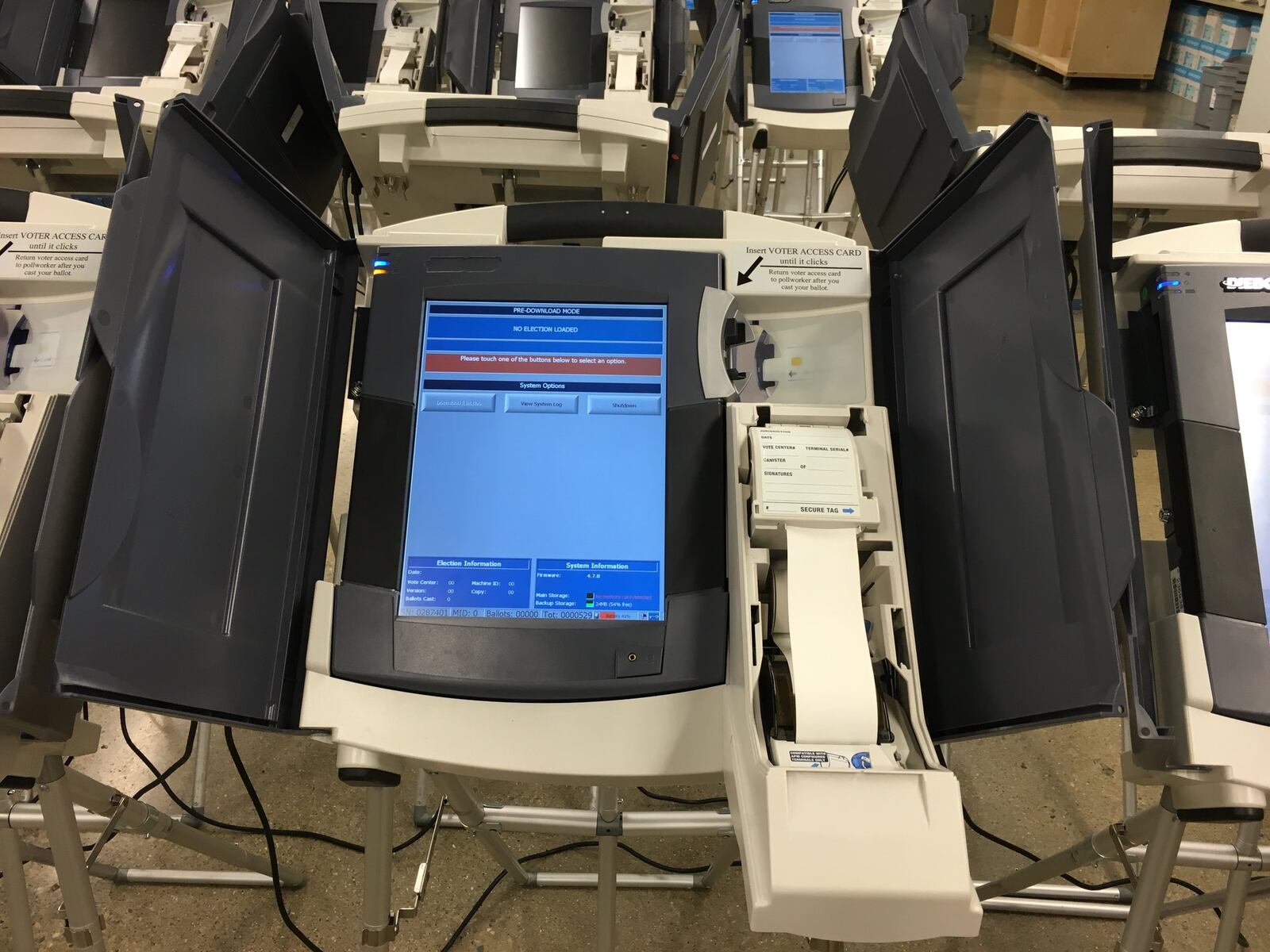 An electronic touch screen voting machine is set up for testing at the Montgomery County Board of Elections. The paper spool will be enclosed at the polls. LYNN HULSEY/STAFF