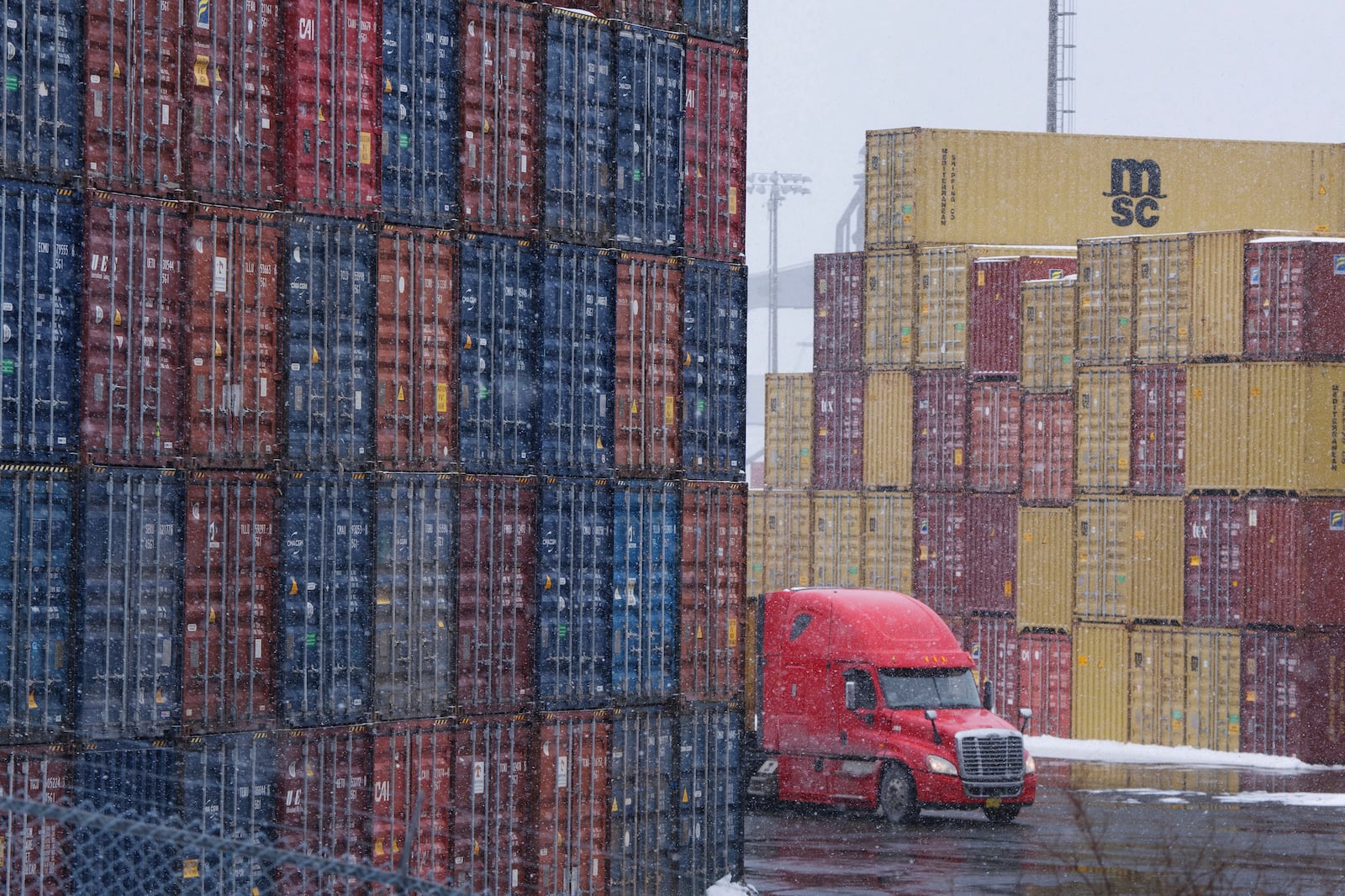 Shipping containers are seen at the Atlantic Hub container terminal in Halifax on Monday, Feb. 3, 2025, one day ahead of imposed tariffs by U.S. President Donald Trump against Canada. (Darren Calabrese/The Canadian Press via AP)