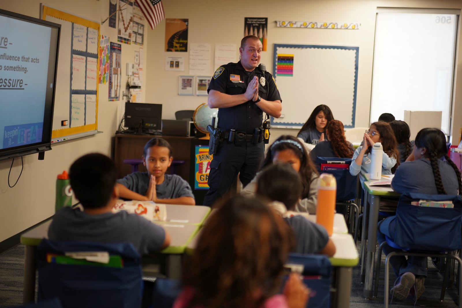 Tyler Olson, a Worthington police officer who also serves as a school resource officer, leads a D.A.R.E. class at the 700-student intermediate school in Worthington, Minn., on Tuesday, Oct. 22, 2024. (AP Photo/Jessie Wardarski)