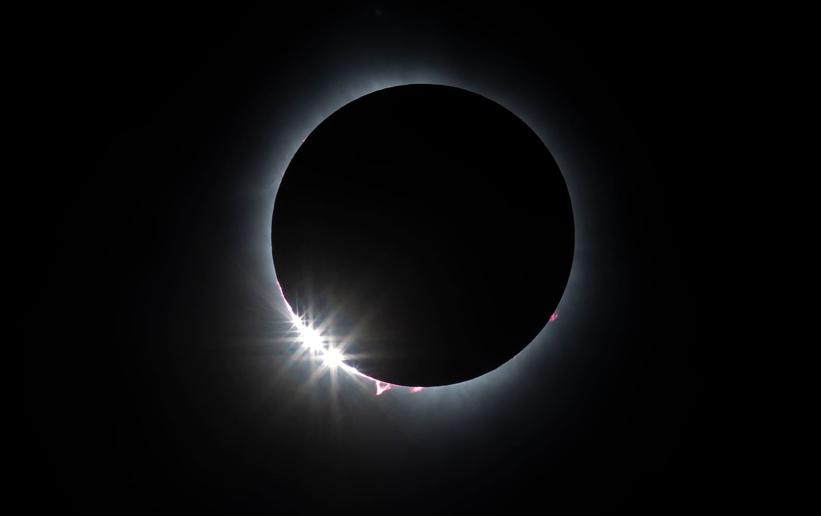 This is a sequence of the total solar eclipse photographed from Marcum Park Monday, April 8, 2024 in Hamilton. NICK GRAHAM/STAFF