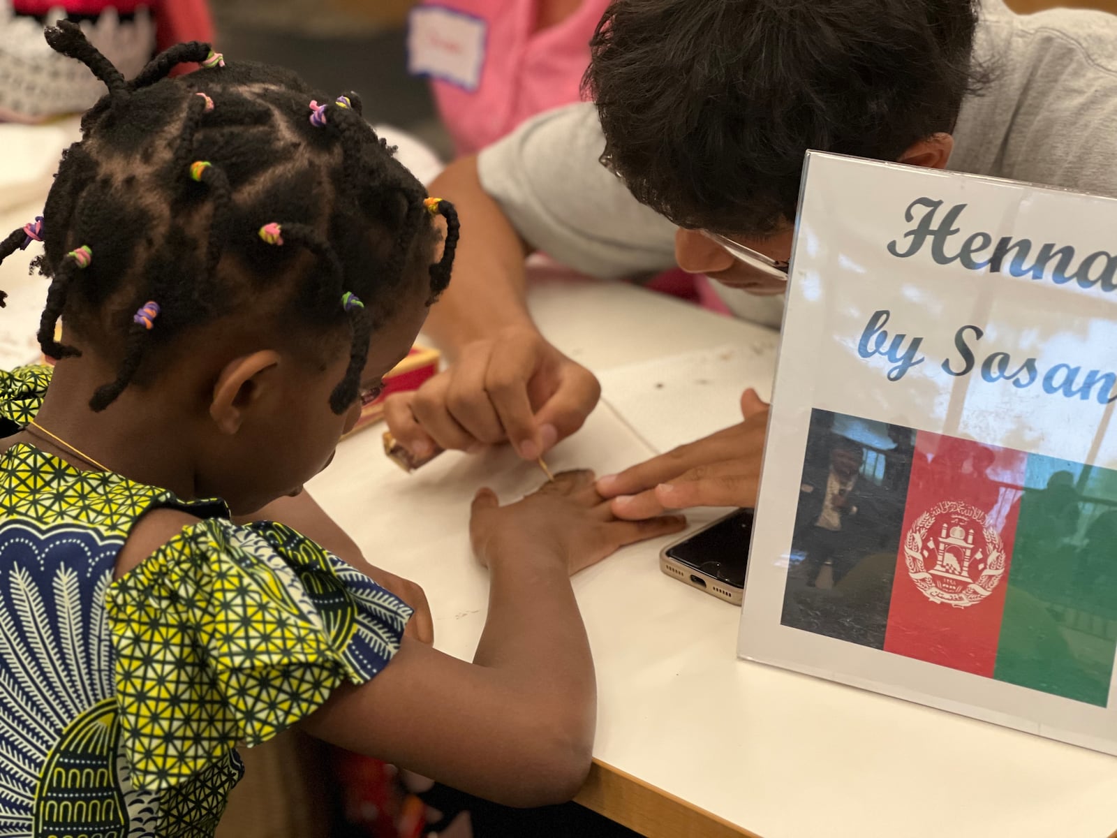 Hundreds of individuals from various countries attended Saturday's World Refugee Day celebration at the Dayton Metro Library's downtown location. AIMEE HANCOCK/STAFF