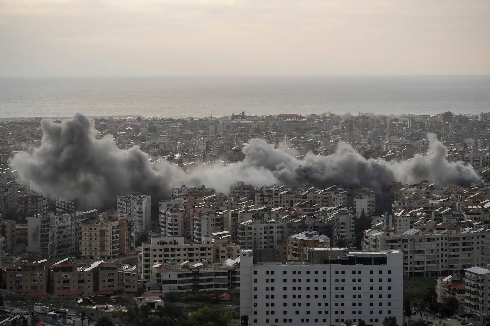 Smoke rise from Israeli airstrikes in Dahiyeh, Beirut, Sunday, Nov. 24, 2024. (AP Photo/Hassan Ammar)