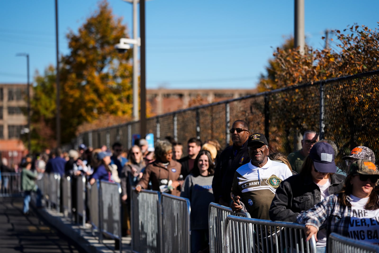 People wait in line to attend a Democratic presidential nominee Vice President Kamala Harris campaign event in Philadelphia, Sunday, Oct. 27, 2024. (AP Photo/Matt Rourke)