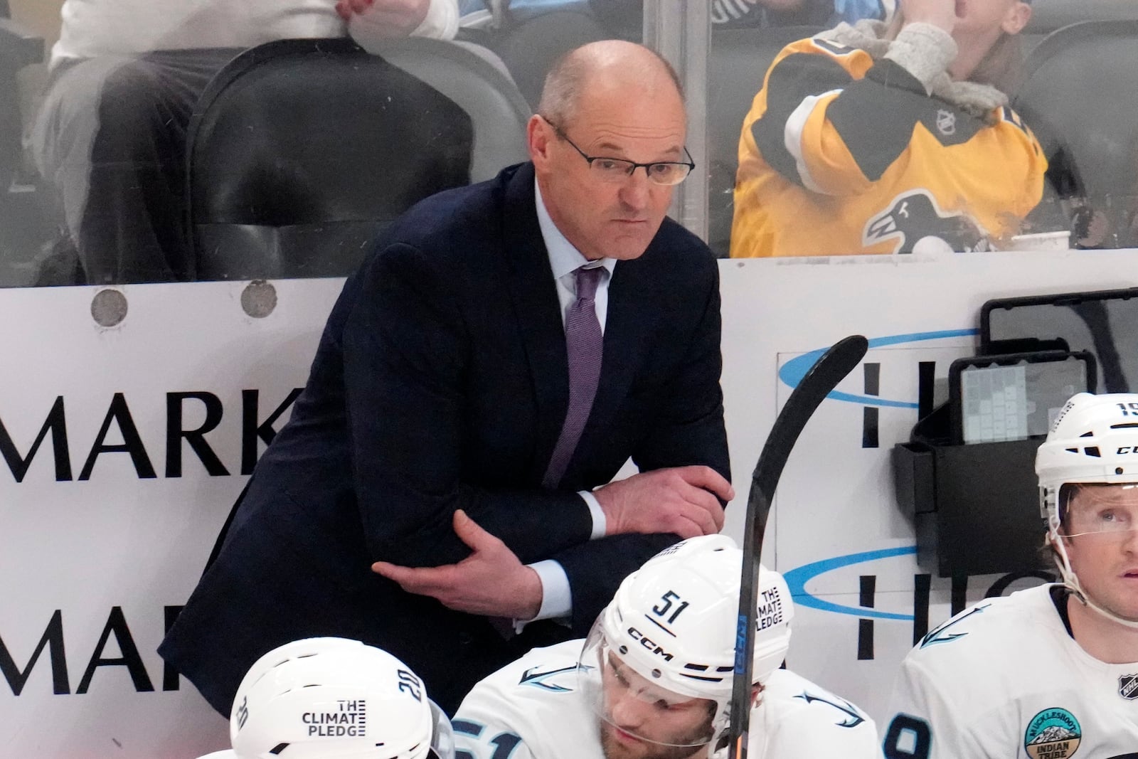 Seattle Kraken head coach Dan Bylsma stands behind his bench during the first period of an NHL hockey game against the Pittsburgh Penguins in Pittsburgh, Tuesday, Jan. 14, 2025. (AP Photo/Gene J. Puskar)