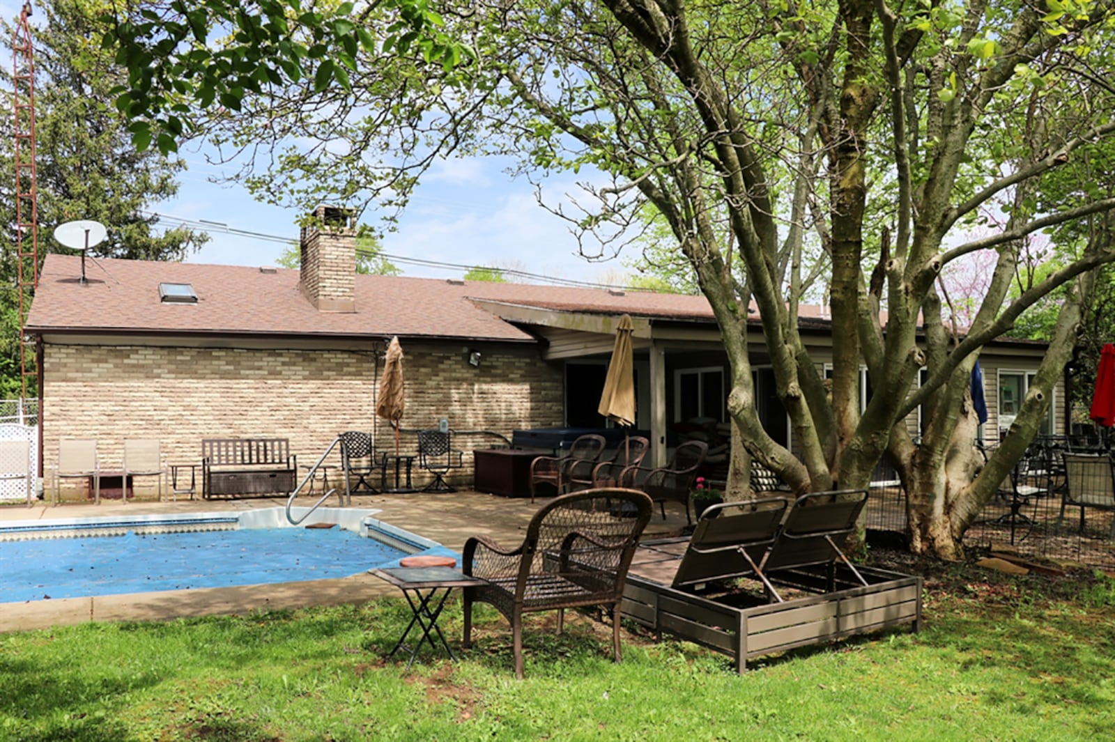 Access from the sun room opens to a shade patio and pool patio. The back yard is surrounded by a fence and a storage shed is conveniently nearby for pool equipment storage. The 16-by-22-foot swimming pool is surrounded by a concrete patio and had an update to the liner in 2021. CONTRIBUTED PHOTO BY KATHY TYLER