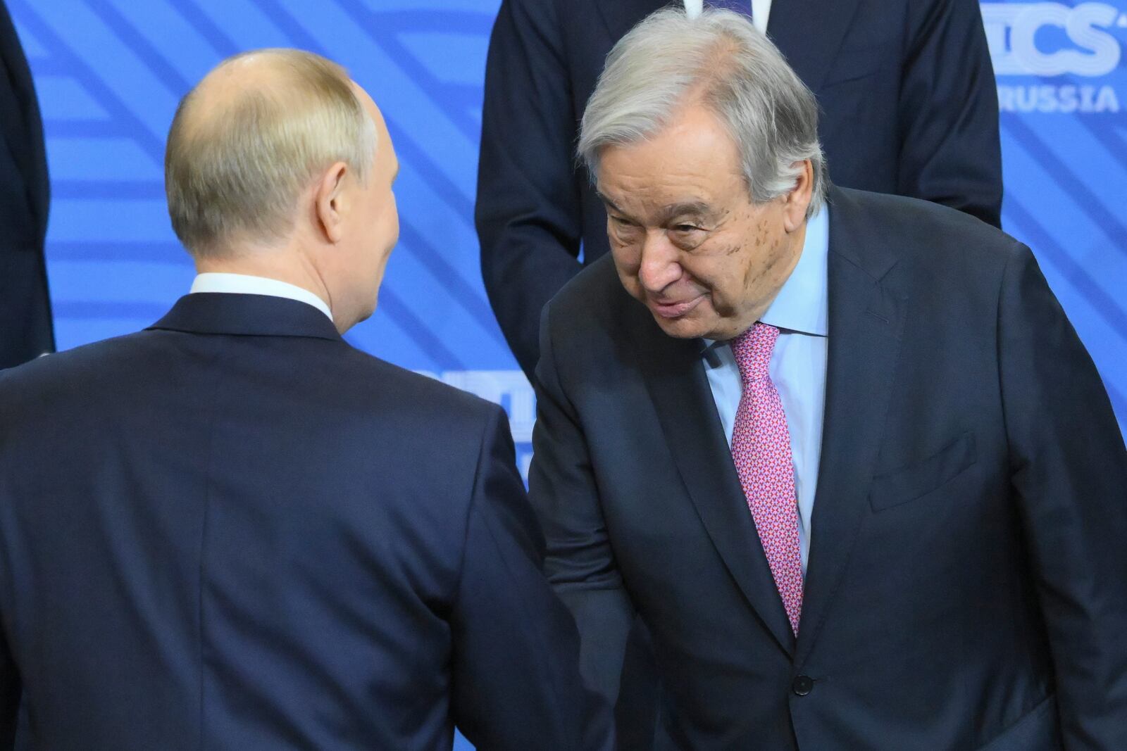 Russian President Vladimir Putin, left, and United Nations Secretary-General Antonio Guterres shake hands during family photo ceremony prior to Outreach/BRICS Plus format session on the sidelines of the BRICS summit in Kazan, Russia, Thursday, Oct. 24, 2024. (Grigory Sysoyev/Photo host brics-russia2024.ru via AP)