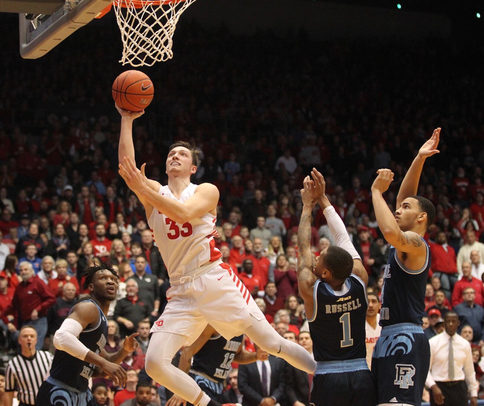 Daytons Ryan Mikesell scores in overtime against Rhode Island on Friday, March 1, 2019, at UD Arena. David Jablonski/Staff