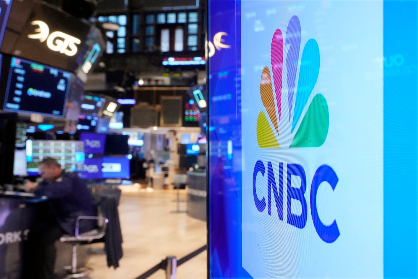 The logo for CNBC appears on the CNBC studio on the floor of the New York Stock Exchange, Wednesday, Nov. 20, 2024. (AP Photo/Richard Drew)