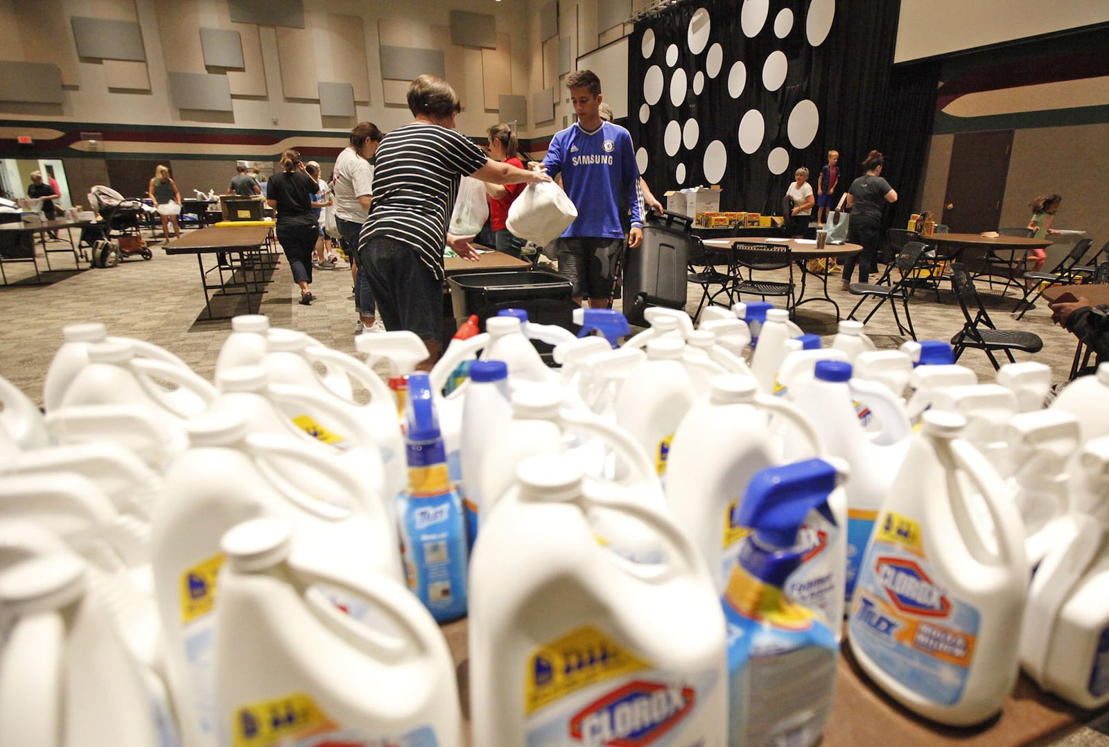 About 60 volunteers gathered at the Christian Life Center in Vandalia on Friday to assemble care packages for people affected by tornado damage. 400 packages of cleaning supplies and 400 packages of food were made for distribution on Saturday by nearly 800 volunteers according to church member Donna LaChance. TY GREENLEES / STAFF