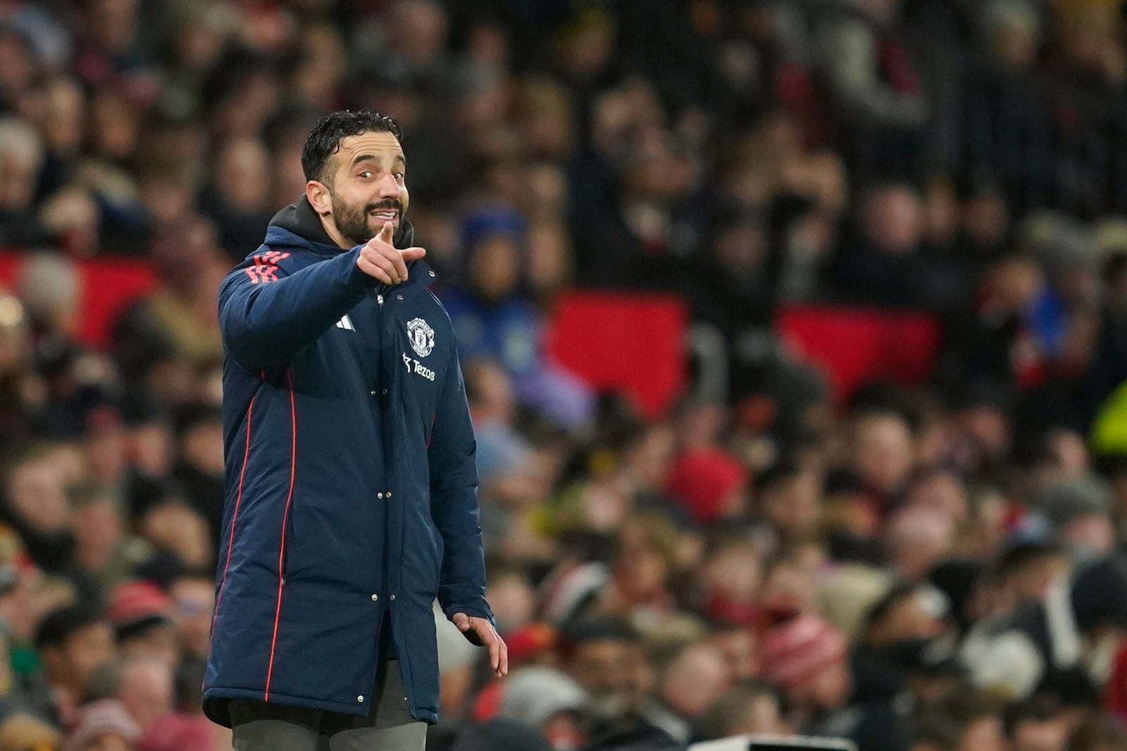 Manchester United's head coach Ruben Amorim gives instructions to his players during the English Premier League soccer match between Manchester United and Ipswich Town at the Old Trafford stadium in Manchester, England, Wednesday, Feb. 26, 2025. (AP Photo/Dave Thompson)