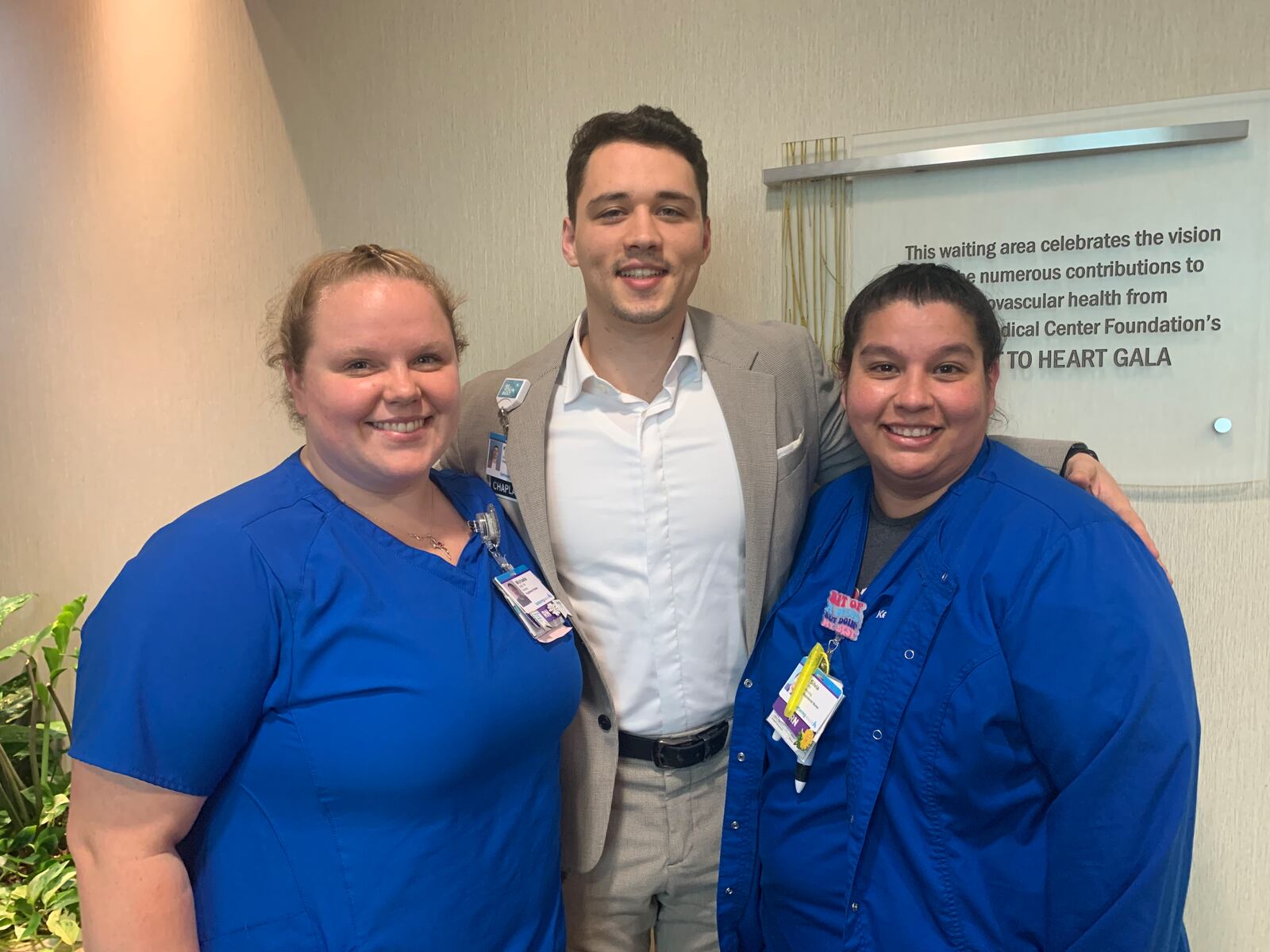 Registered nurses Michaela Yinger (left) and Silvia Hernandez and (right) with Chaplain Kevin Gill Walter (middle) at Kettering Health Main Campus. Yinger, Hernandez, and Walter helped organize a vow renewal ceremony for patient Dale Tufts, of Piqua, and his wife, Frances Tufts, on Oct. 30, 2023. Frances later died on Nov. 10, and Dale died on Dec. 24. CONTRIBUTED