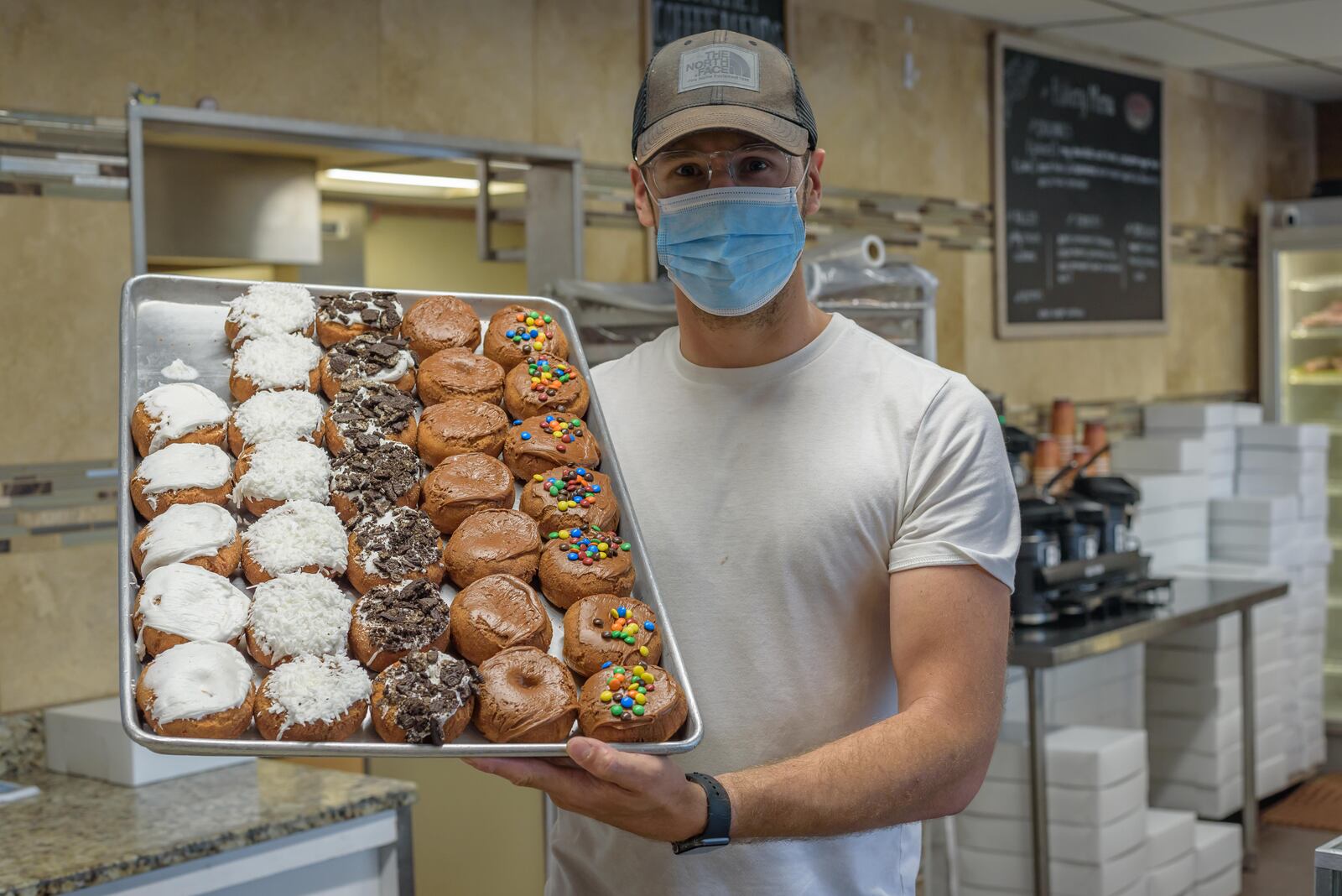 Happy National Donut Day! Here's a look behind-the-scenes of the donut making process at Bear Creek Donuts in Miamisburg and The Donut Haus Bakery in Springboro. Top sellers at Bear Creek Donuts are apple fritters and yeast rings (sprinkled with Oreo, Fruity Pebbles or maple bacon). Apple fritters and sour cream donuts are the top sellers at The Donut Haus Bakery. National Donut Day was started in 1938 by the Salvation Army to honor their Salvation Army Donut Lassies aka Donut Girls, volunteers who made fresh donuts during World War I for American soldiers serving in France. TOM GILLIAM / CONTRIBUTING PHOTOGRAPHER