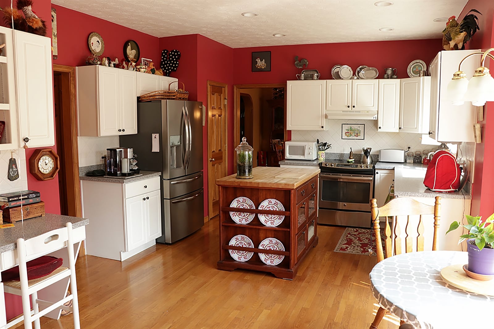 Filled with white cabinetry and granite countertops, the kitchen has a center island with butcher-block countertop and a planning desk corner. The bay bump-out allows for a breakfast nook. CONTRIBUTED PHOTO BY KATHY TYLER