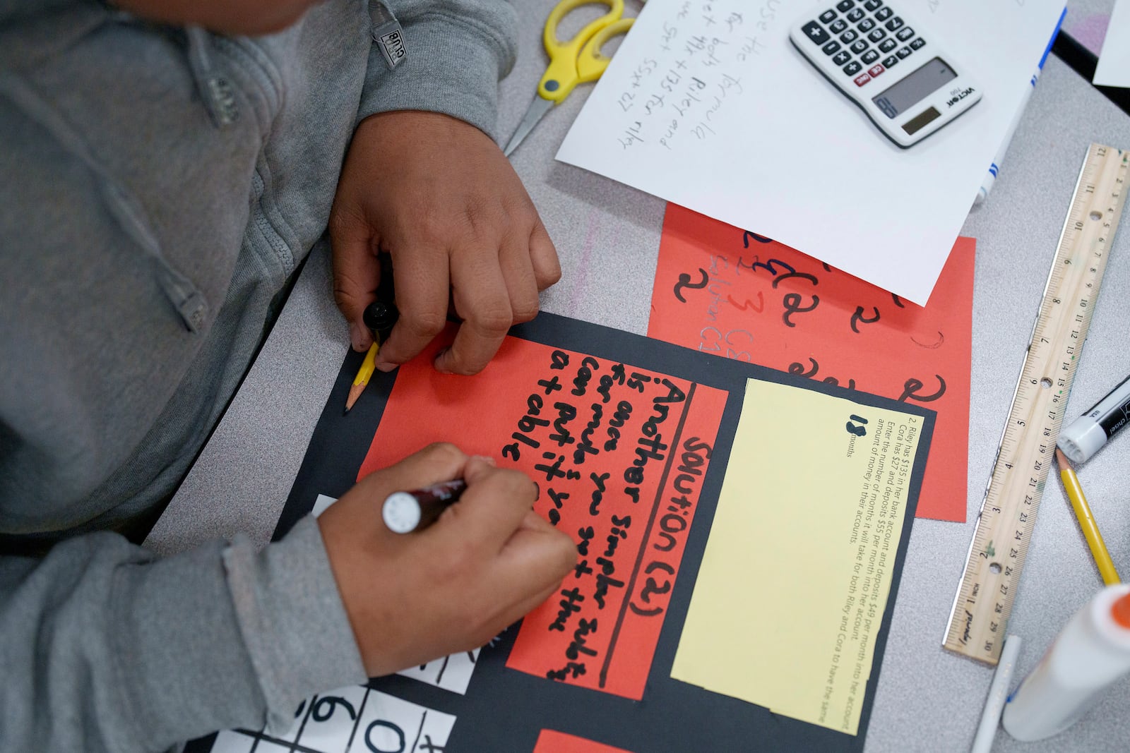 A student works in a classroom at Benjamin O. Davis Middle School in Compton, Calif., Thursday, Feb. 6, 2025. (AP Photo/Eric Thayer)