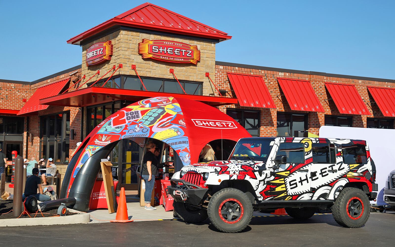 Hundreds of people visit the new Sheetz in Springfield Twp. Tuesday, Oct. 3, 2023 during their grand opening. The new gas station, convenience store and restaurant is located at 4700 S. Charleston Pike. The grand opening offered give aways, raffle prizes and cheap gas. The new Sheetz is the company's 89th store in Ohio. BILL LACKEY/STAFF