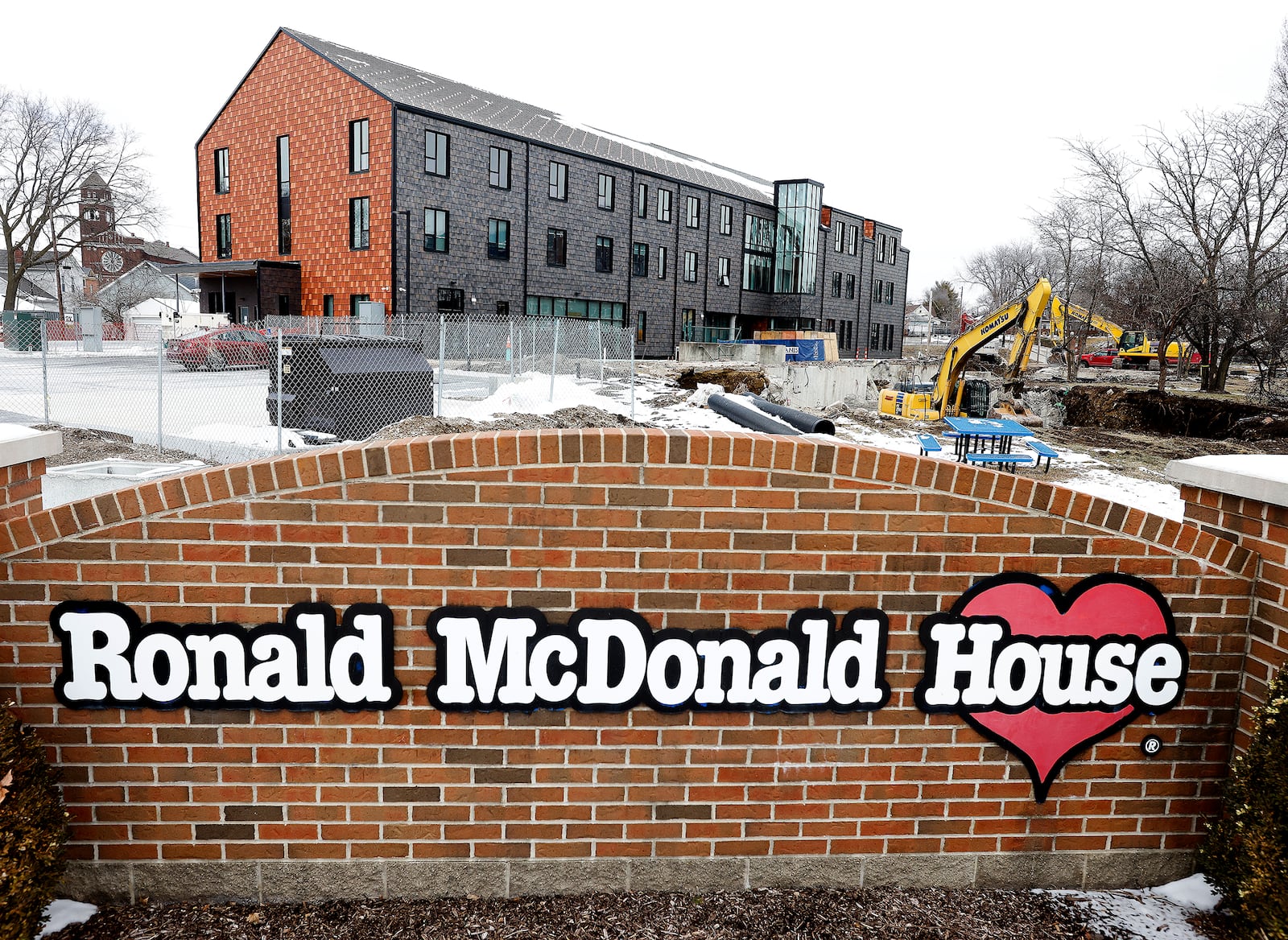 Ronald McDonald House Charities Dayton demolishes its former building after nearing the completion of construction on its new facility, which triples the amount of space it had to house families it had in its old building. The demolition began Feb. 11, 2025. MARSHALL GORBY\STAFF