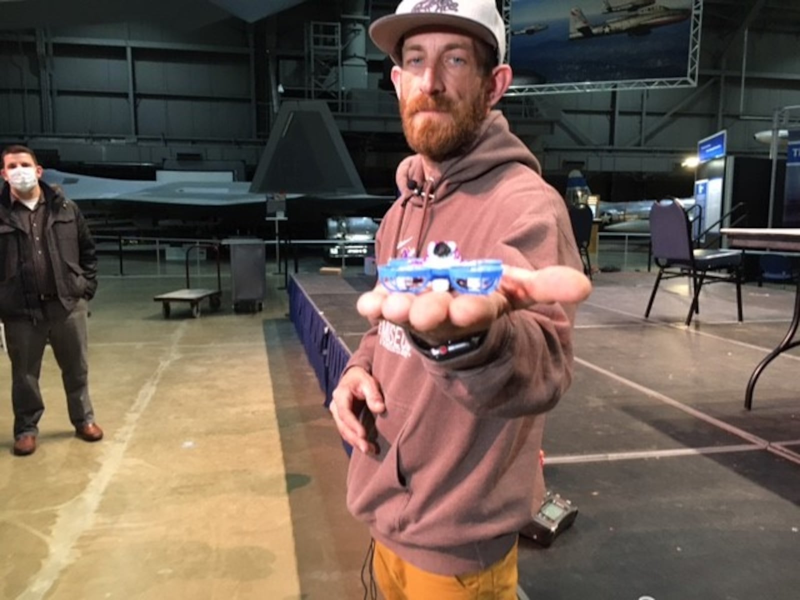 Kele Stanley, drone pilot and an organizer of the micro-drones racing event Saturday at the National Museum of the U.S. Air Force. In this photo, Stanley is holding a "Tiny Whoop" micro-drone. THOMAS GNAU/STAFF