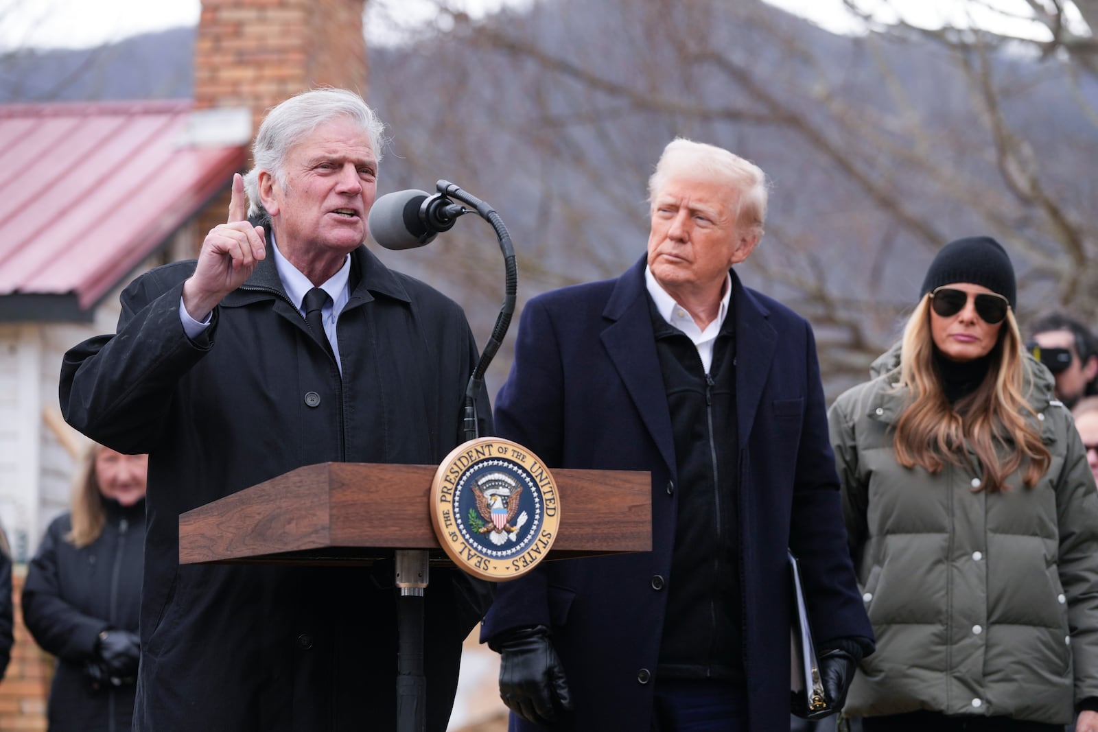 Franklin Graham speaks along side President Donald Trump and first lady Melania Trump, as they meet with homeowners affected by Hurricane Helene in Swannanoa, N.C., Friday, Jan. 24, 2025. (AP Photo/Mark Schiefelbein)