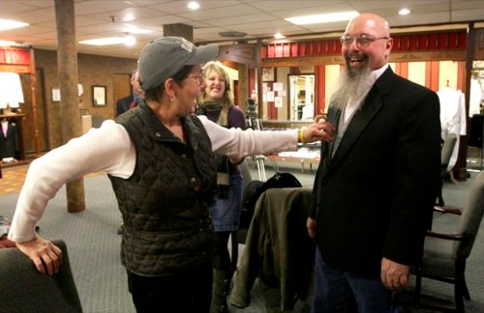 Filmaker Julia Reichert (left) admires the tuxedo worn by Paul "Popeye" Hurst at Price Stores. Kim Clay and Hurst will where their tuxedos to the Academy Awards in Los Angeles on Sunday, March 7, 2010. They were featured in the Oscar-nominated documentary film "The Last Truck: Closing of a GM Plant," which was made by Reichert and Steven Bognar.