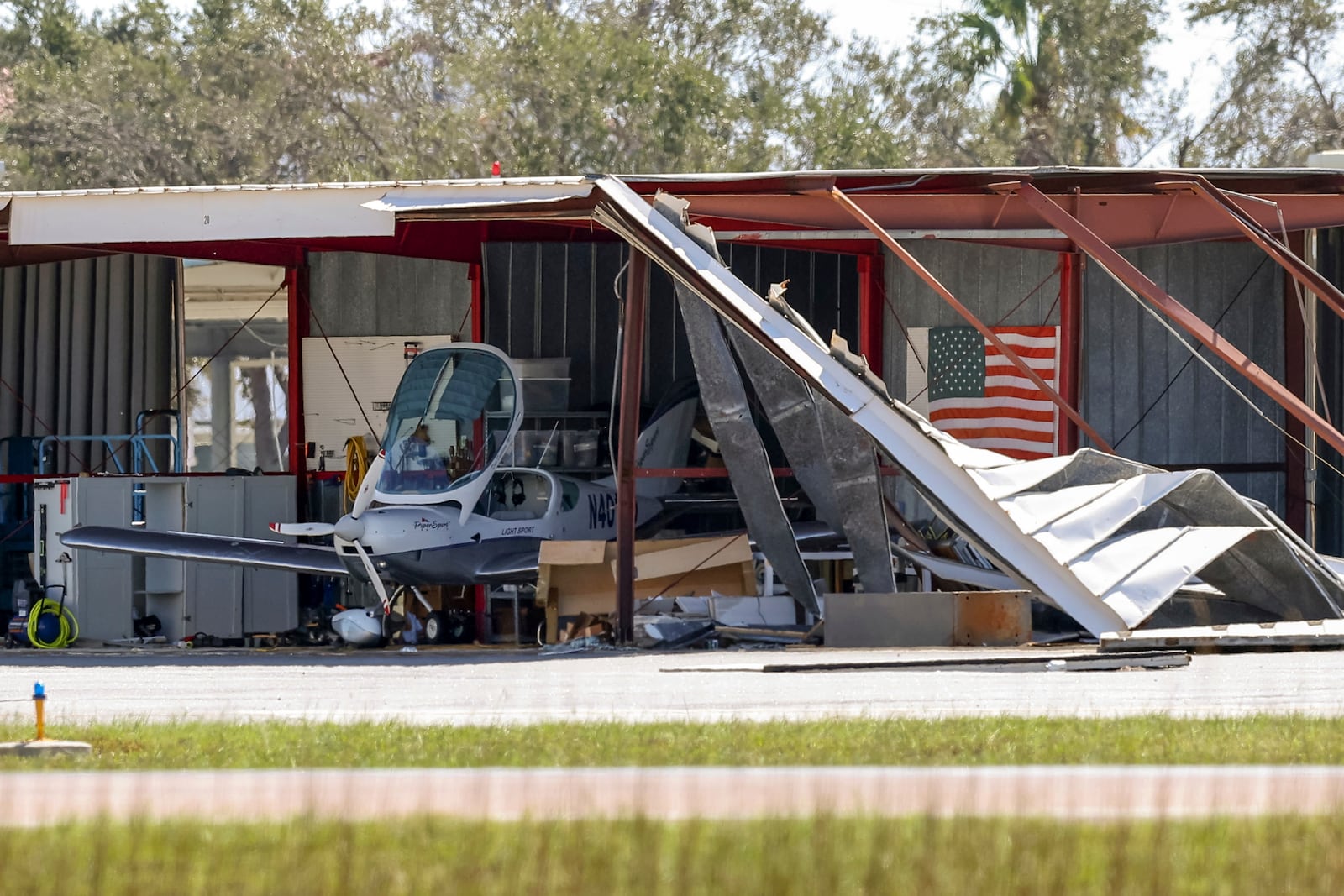 Hangars at Albert Whitted Airport were damaged by winds from Hurricane Milton on Thursday, Oct. 10, 2024, in St. Petersburg, Fla. (AP Photo/Mike Carlson)