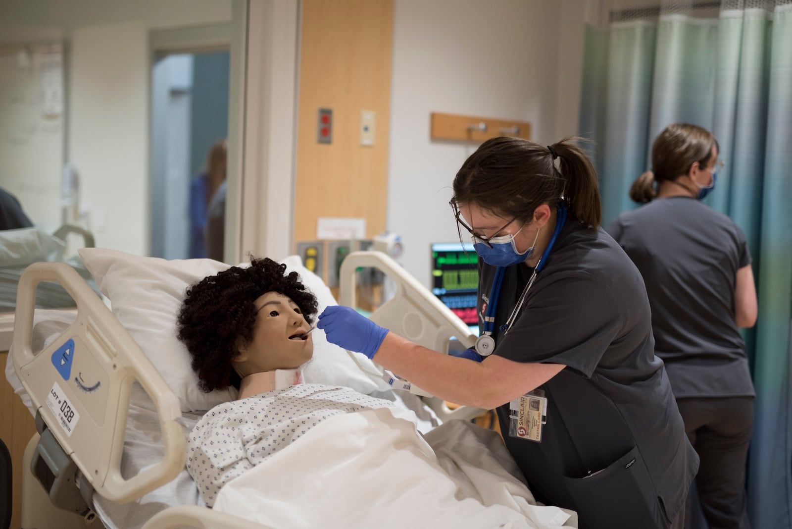 Sinclair nursing student Roxanne Draper works in a classroom setting. Sinclair is adding 18 new spots per year to its nursing program. Courtesy of Sinclair Community College.