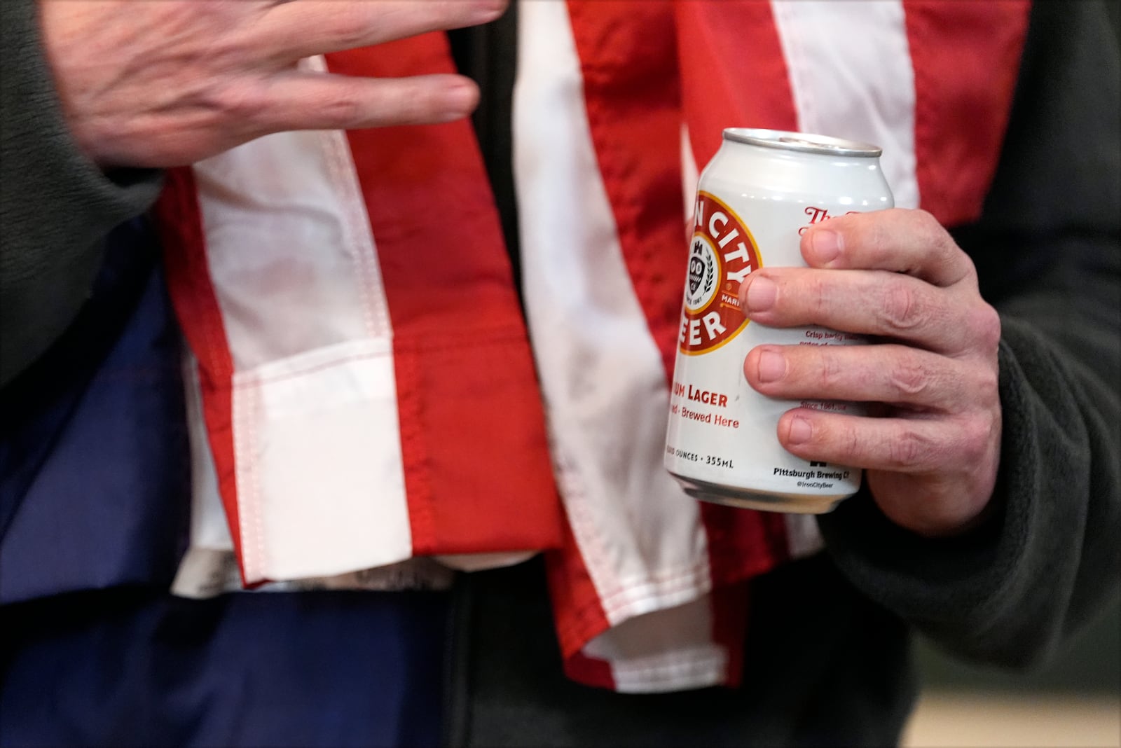 Marc Fogel holds an Iron City Beer as he speaks in the Diplomatic Reception Room at the White House with President Donald Trump, Tuesday, Feb. 11, 2025, in Washington. (Photo/Alex Brandon)