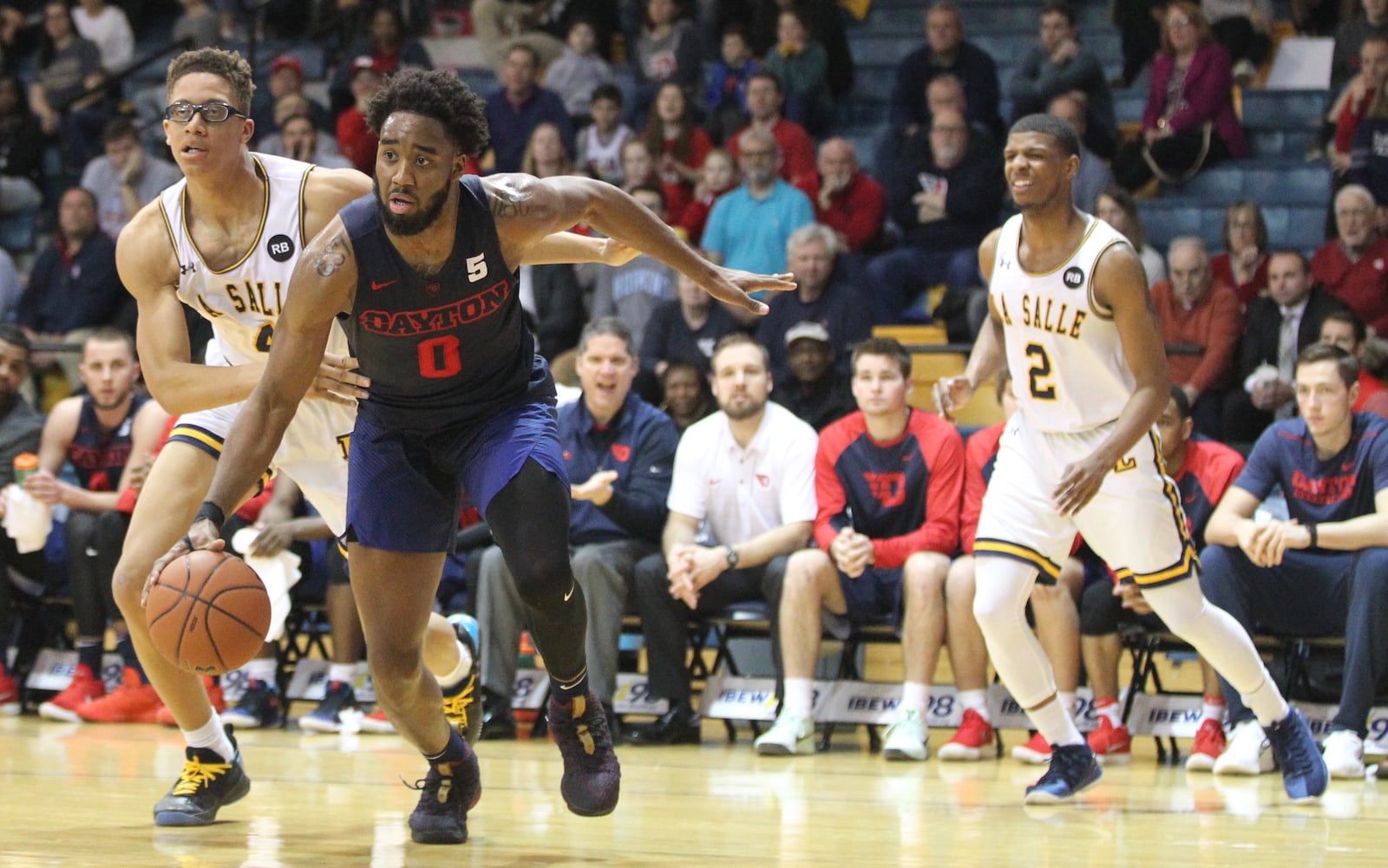 Dayton’s Josh Cunningham drives to the basket against La Salle on Wednesday, Feb. 28, 2018, at Tom Gola Arena in Philadelphia. David Jablonski/Staff