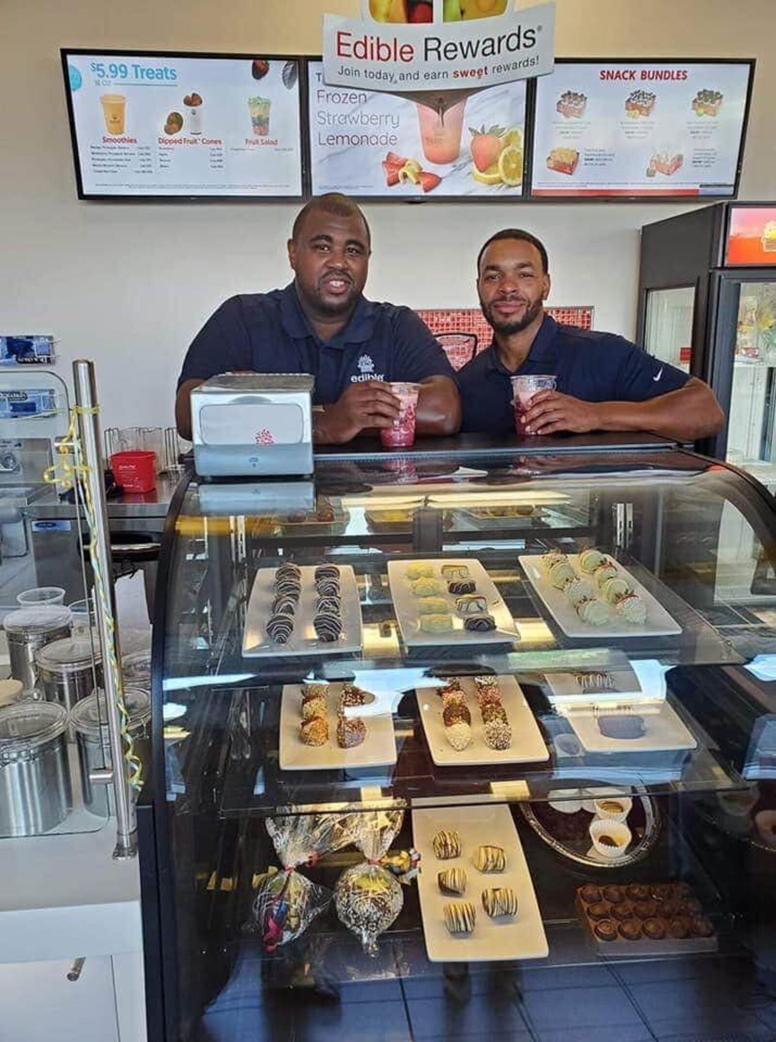 Chad Diggs, left, and Trenton Nalls are co-franchise owners of the Edible Arrangements store that just relocated from Far Hills Avenue in Kettering to 2665 S. Dixie Drive in Kettering. SUBMITTED