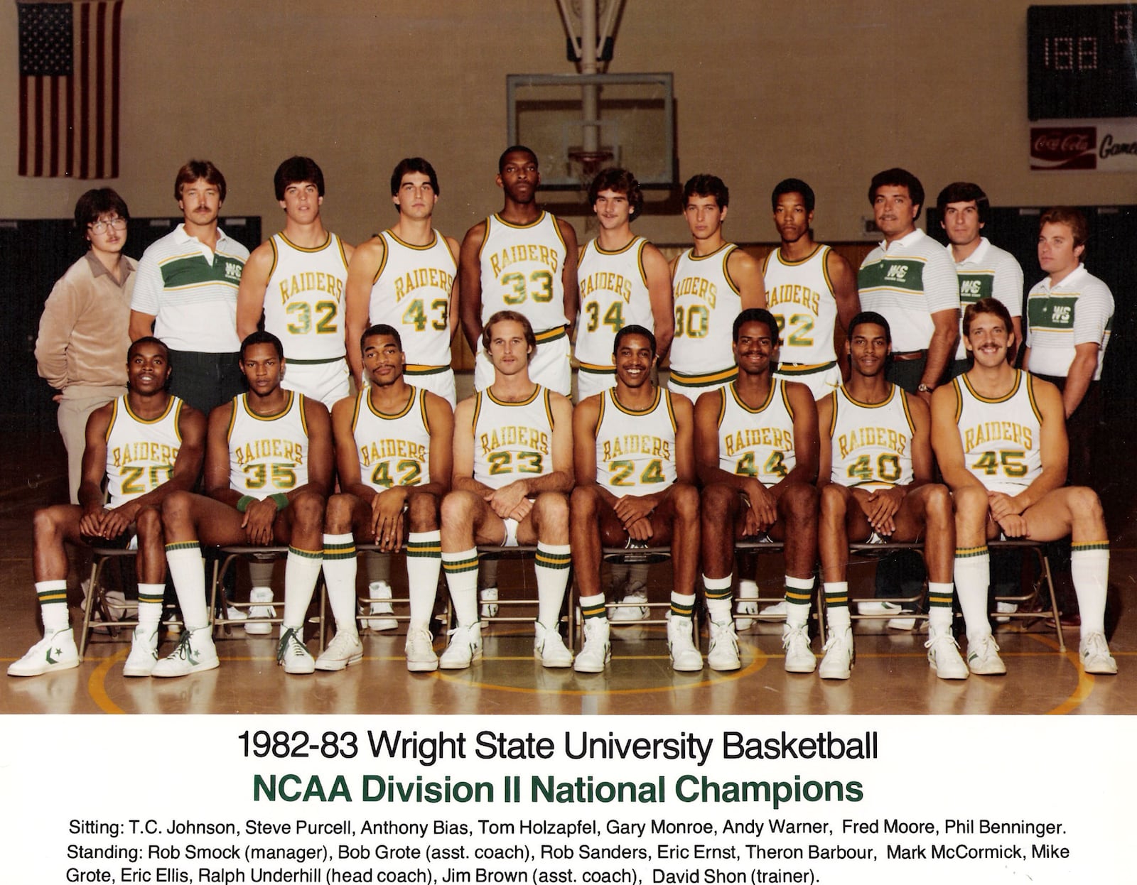 1982-83 Wright State University basketball, NCAA Division II National Champions, (sitting): T.C. Johnson, Steve Purcell, Anthony Bias, Tom Holzapfel, Gary Monroe, Andy Warner, Fred Moore, Phil Benninger, (standing): Rob Smock (manager), Bob Grote (asst. coach), Rob Sanders, Eric Ernst, Theron Barbour, Mark McCormick, Mike Grote, Eric Ellis, Ralph Underhill (head coach), Jim Brown (asst. coach), David Shon (trainer)