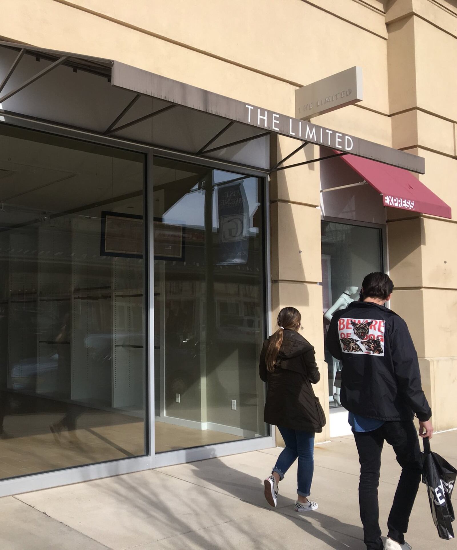 Shoppers walk by the space formerly occupied by The Limited at The Greene Town Center in Beavercreek. KARA DRISCOLL/STAFF