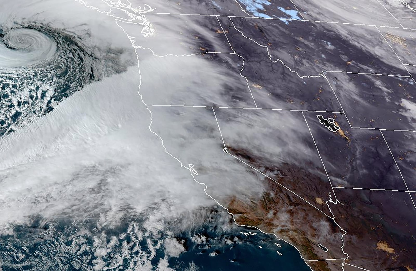 This Nov. 19, 2024 satellite image provided by the National Oceanic and Atmospheric Administration shows an atmospheric river moving in on Northern California and the Pacific Northwest. (NOAA via AP)