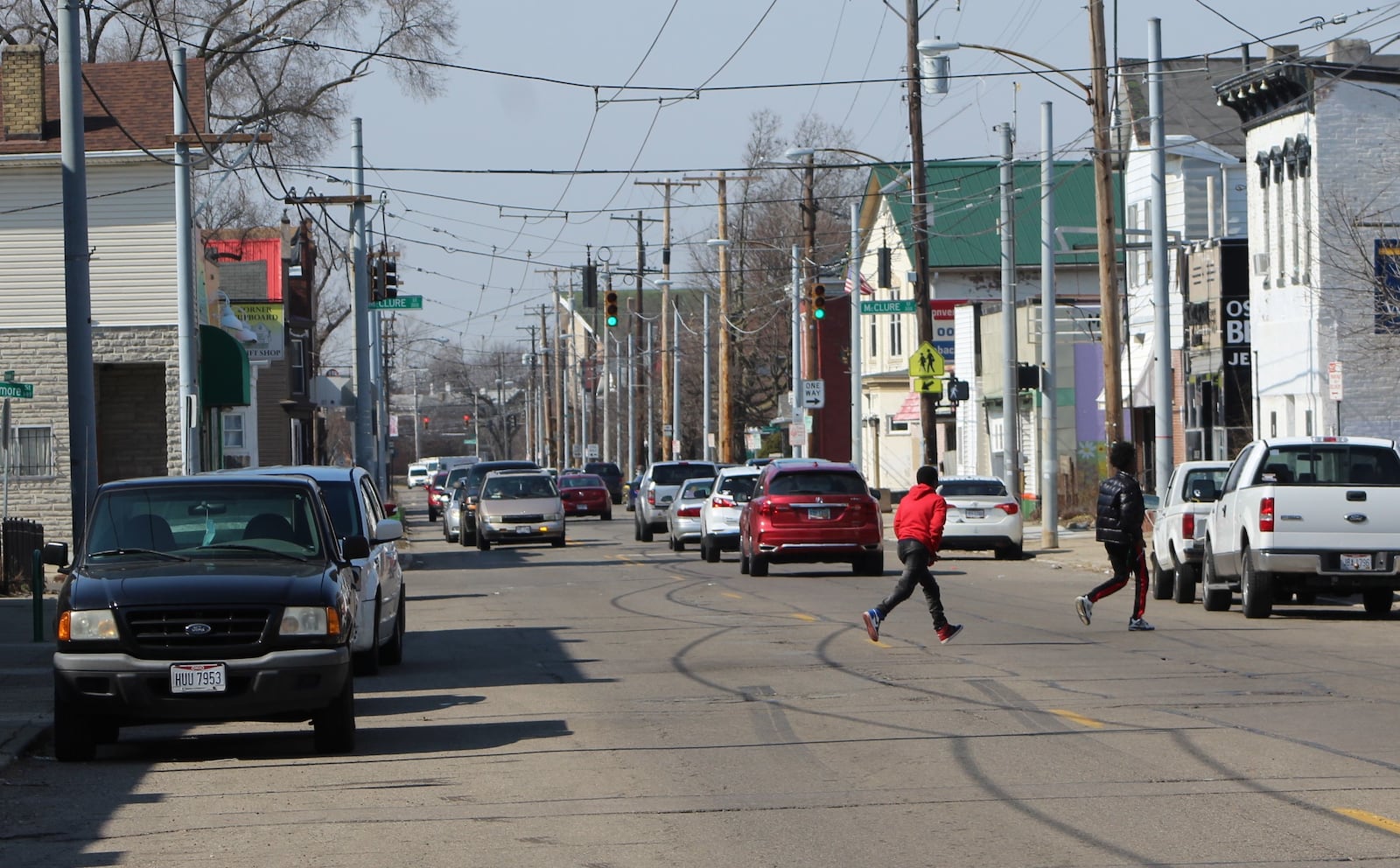 Teens cross Xenia Avenue on Monday. CORNELIUS FROLIK / STAFF