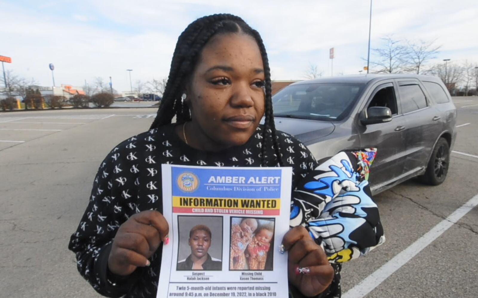 Wilhelmina Barnett, the mother of missing 5-month-old Kason Thomas, came to the Dayton-area Wednesday, Dec. 21, 2022, to search for her son. Kason was in a 2010 Honda Accord with his twin brother, Ky'air Thomas, when it was stolen in Columbus on Dec. 19, 2022. Ky'air was found at a Dayton International Airport parking lot, but police are continuing to look for Kason and a suspect, Nalah Jackson. MARSHALL GORBY / STAFF