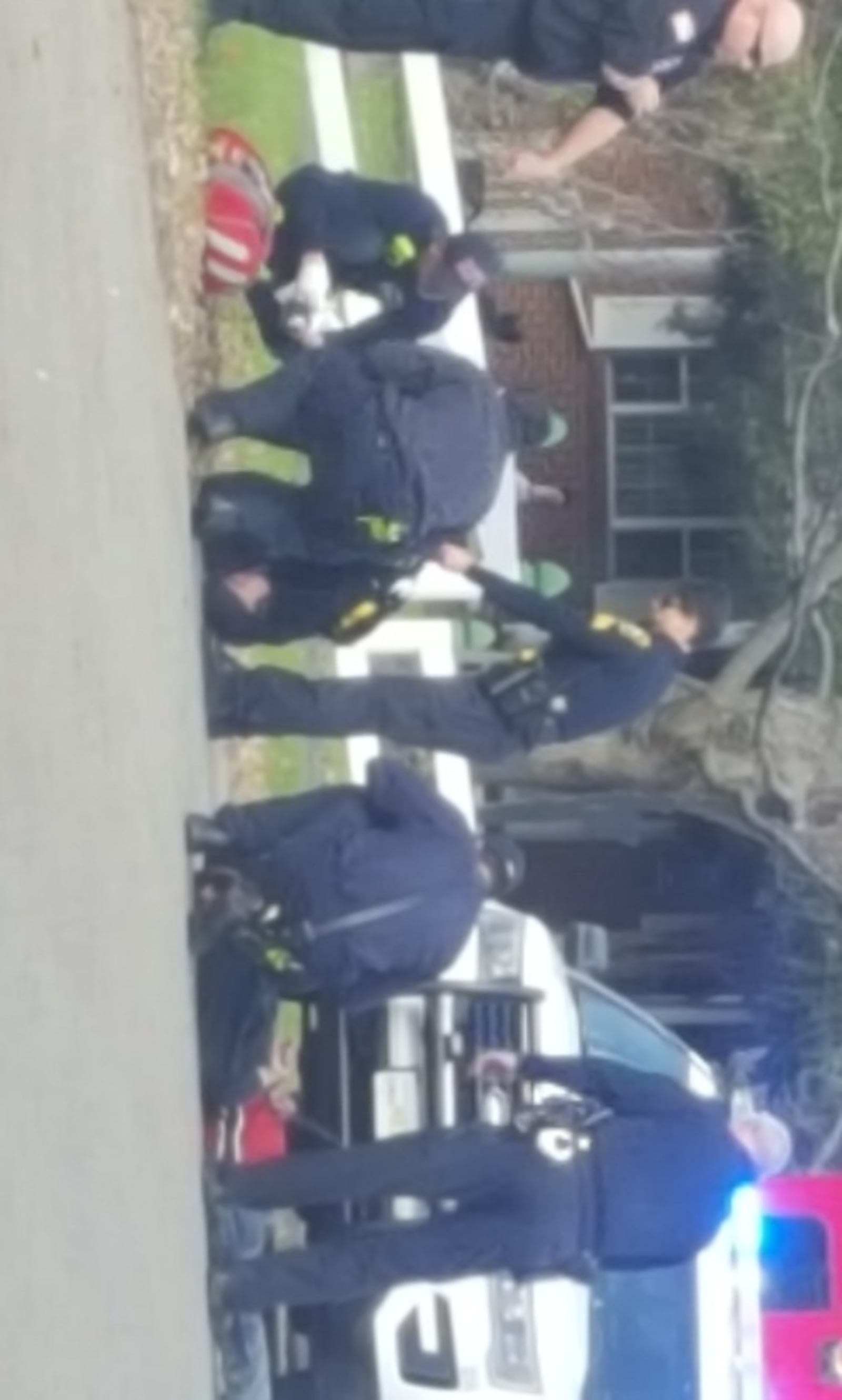 Officers surround a fellow officer who was hurt at the scene of a domestic violence call in Riverside. CONTRIBUTED PHOTO/Joey Eckels