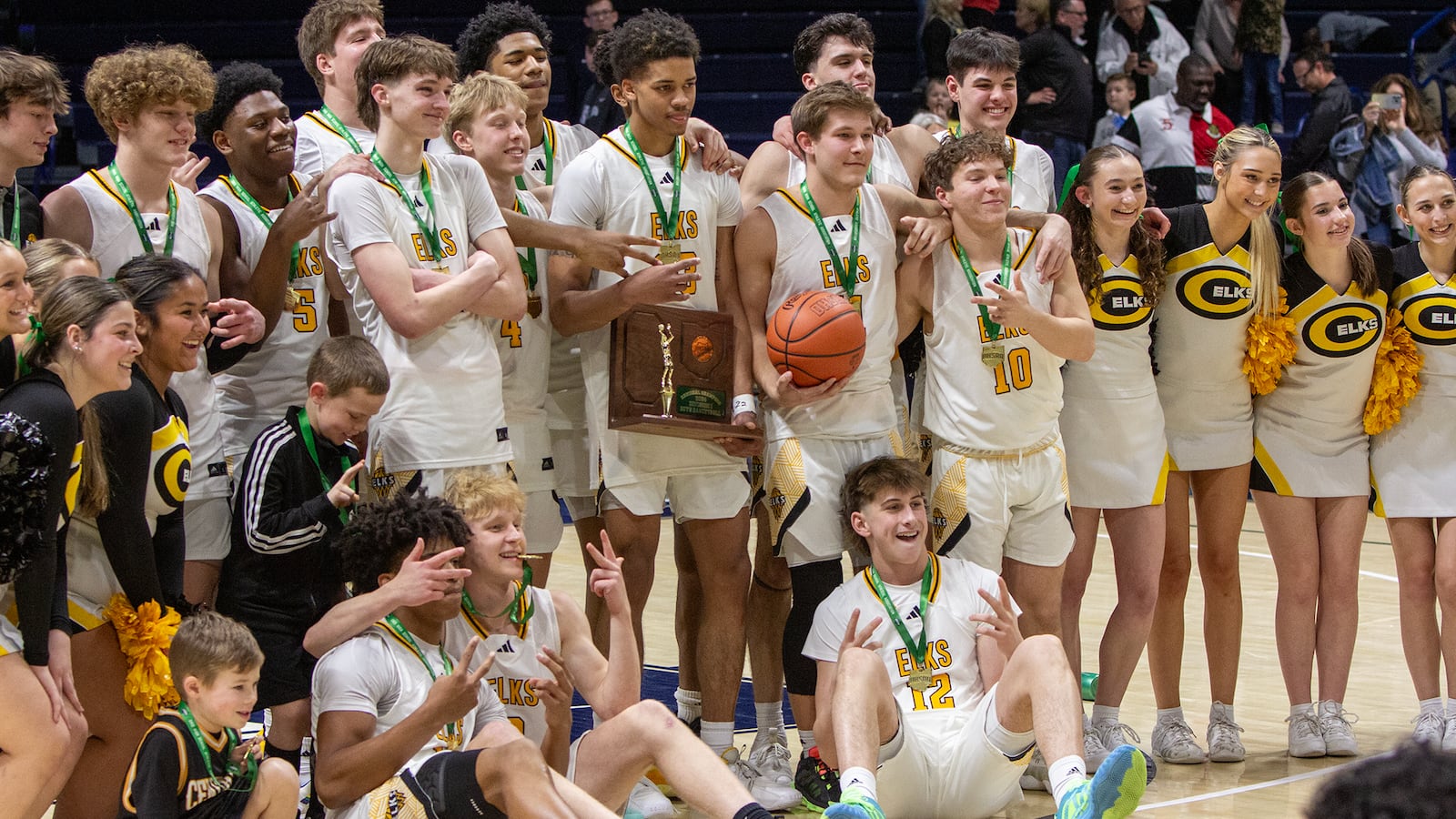 Centerville poses with the trophy at the Cintas Center Saturday. Centerville won the Division I region title 70-69 in double overtime. Jeff Gilbert/CONTRIBUTED