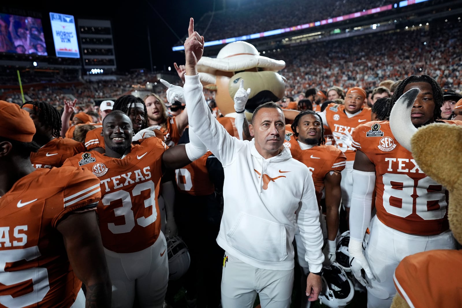 Texas head coach Steve Sarkisian celebrates with his team after a first round game against Clemson in the College Football Playoff, Saturday, Dec. 21, 2024, in Austin, Texas. (AP Photo/Eric Gay)