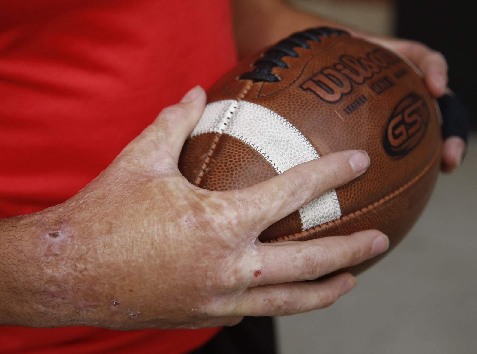 Sidney High School senior running back Isaiah Bowser is one of the front runners for Ohio’s Mr. Football. As a child, Bowser was abused by his mother’s boyfriend who burned Bowser’s hands in scalding water and ended up imprisoned because of it. TY GREENLEES / STAFF