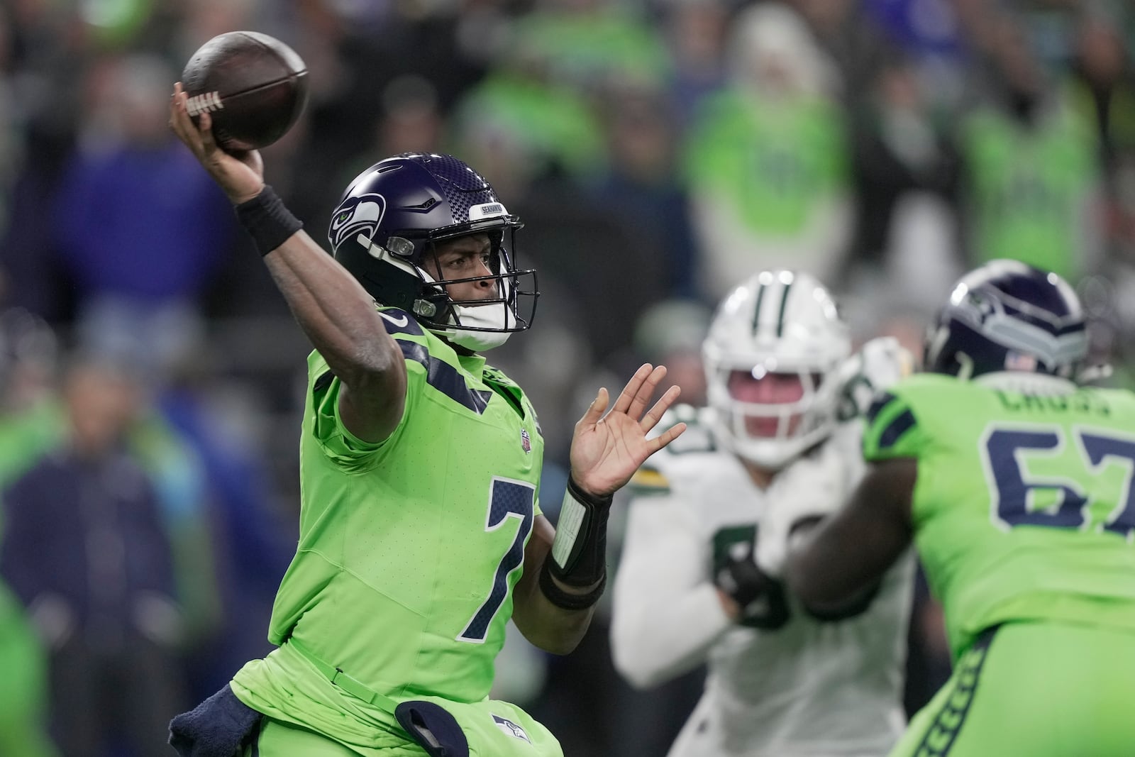 Seattle Seahawks' Geno Smith throws during the first half of an NFL football game against the Green Bay Packers Sunday, Dec. 15, 2024, in Seattle. (AP Photo/Stephen Brashear)