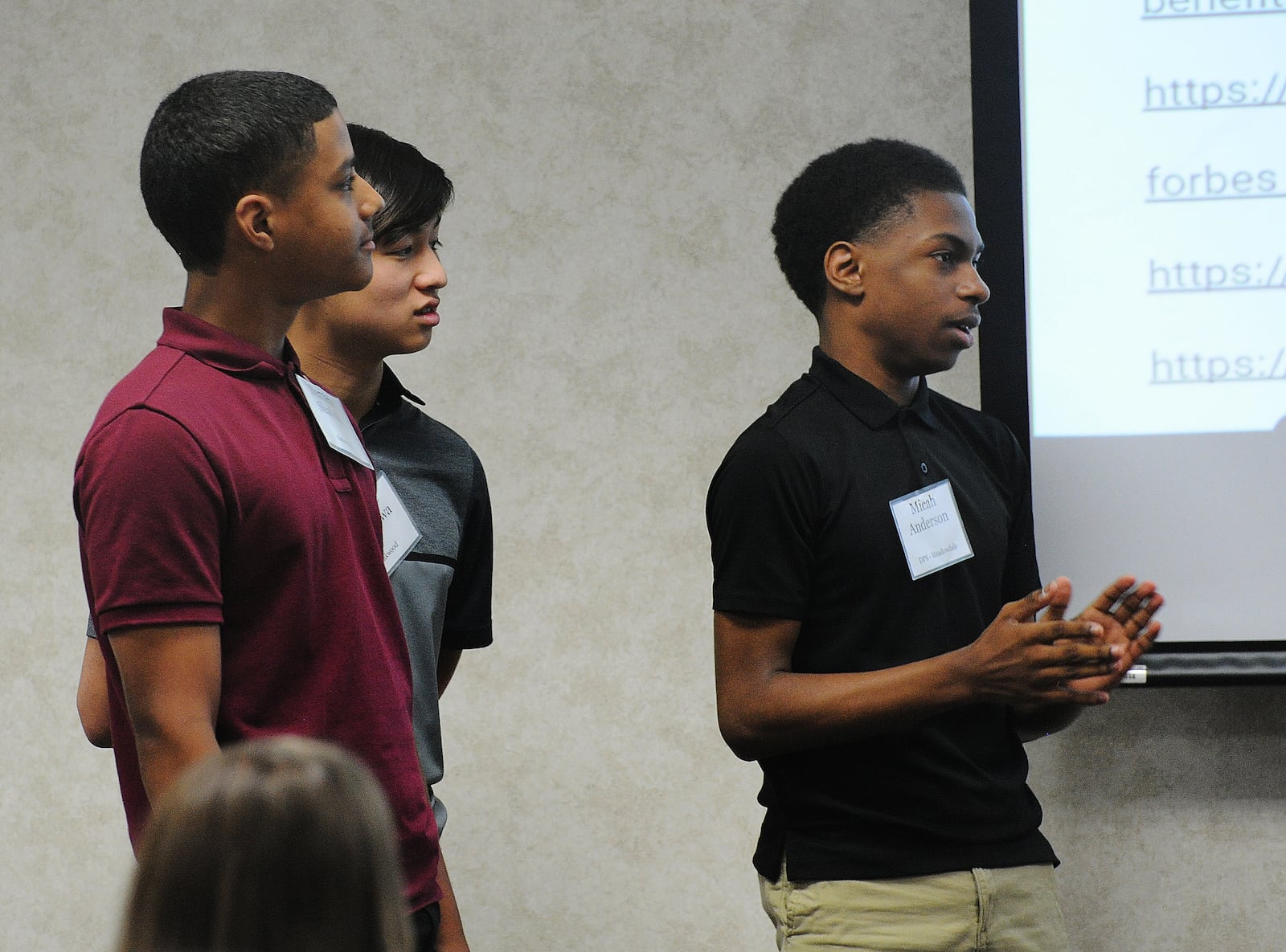 Students from left, Dermaris Shafeek, Mingde Hirakawa and Micah Anderson were part of a team that presented their final project Wednesday, June 12, 2024 for Inside Dayton. MARSHALL GORBY\STAFF