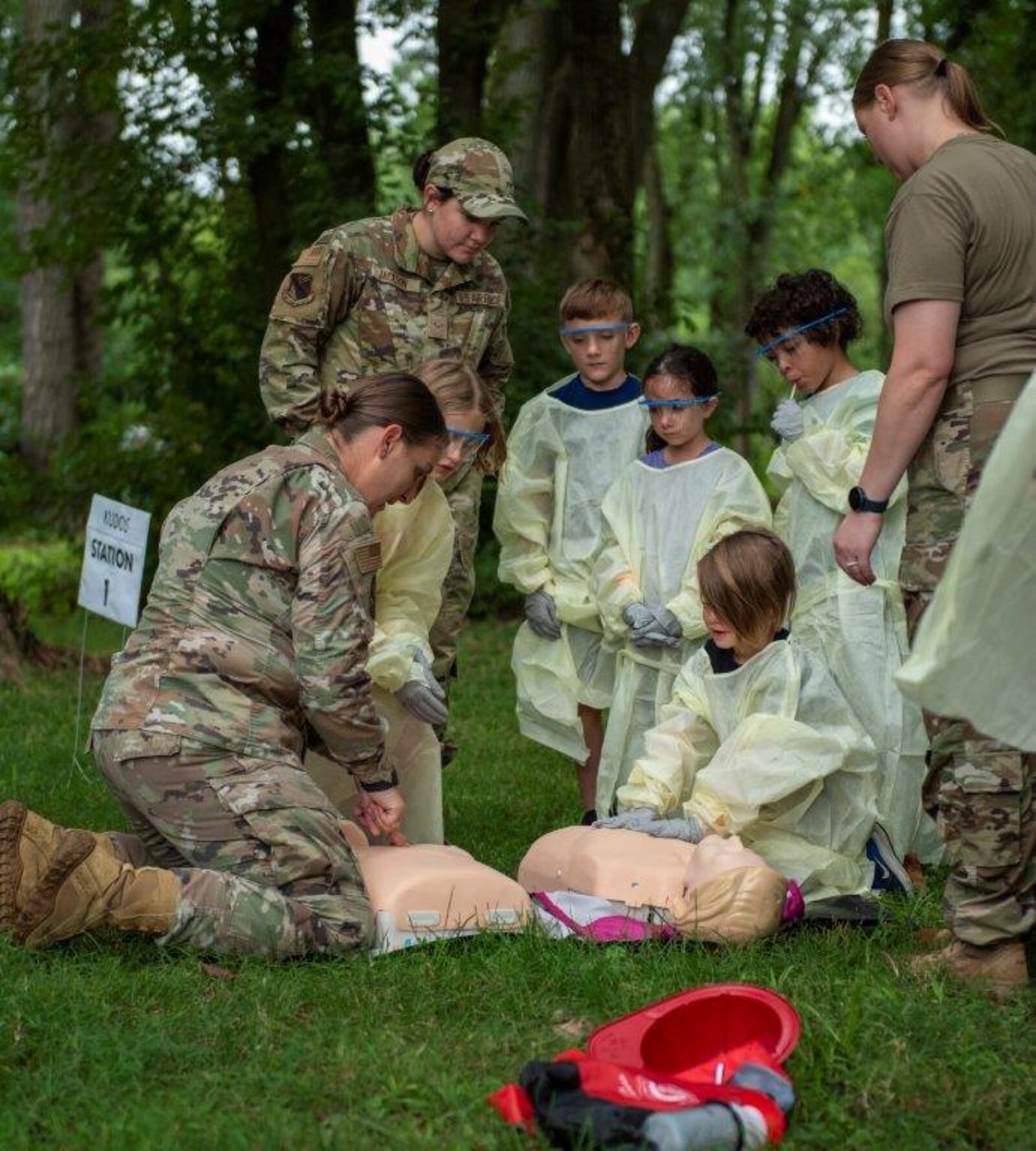 Children take part in a CPR exercise led by 88th Medical Group Airmen during the Kids Understanding Deployment Operations event Aug. 5 at Wright-Patterson Air Force Base. U.S. AIR FORCE PHOTO/AIRMAN 1ST CLASS JAMES JOHNSON