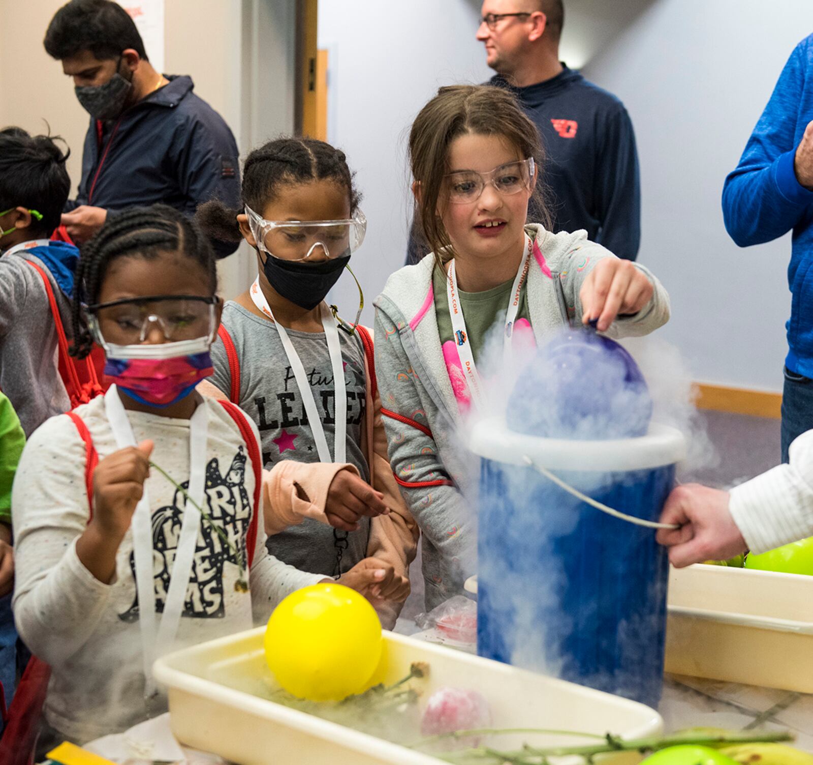 Children freeze a balloon using liquid nitrogen March 13 during the Big Hoopla STEM Challenge at Dayton Convention Center. U.S. AIR FORCE PHOTO/SENIOR AIRMAN ALEXANDRIA FULTON