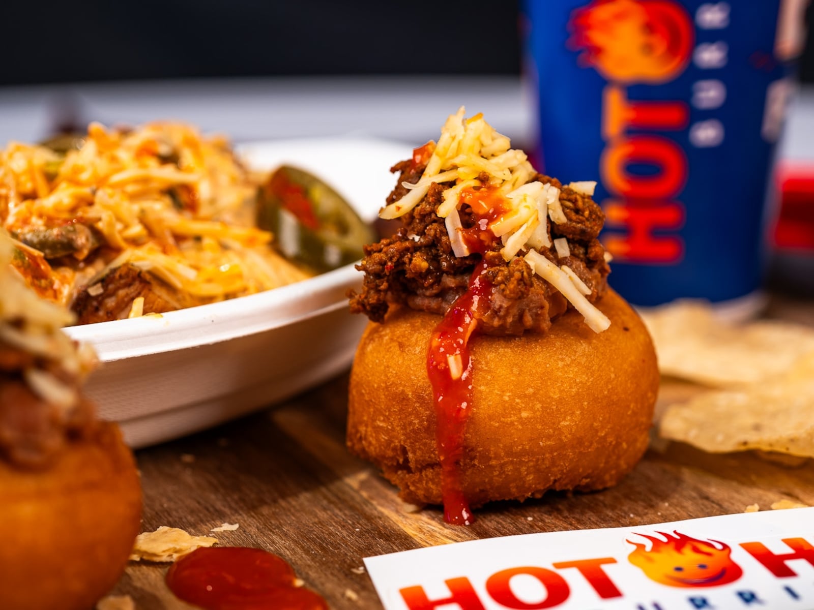 Death Grip Donuts and Hot Head Burritos are teaming up for two special pop-up events at The Mall at Fairfield Commons in Beavercreek. Pictured is The Reaper, a donut filled with chorizo and refried beans, smothered in ghost pepper sauce and topped with shredded reaper cheese (CONTRIBUTED PHOTO).