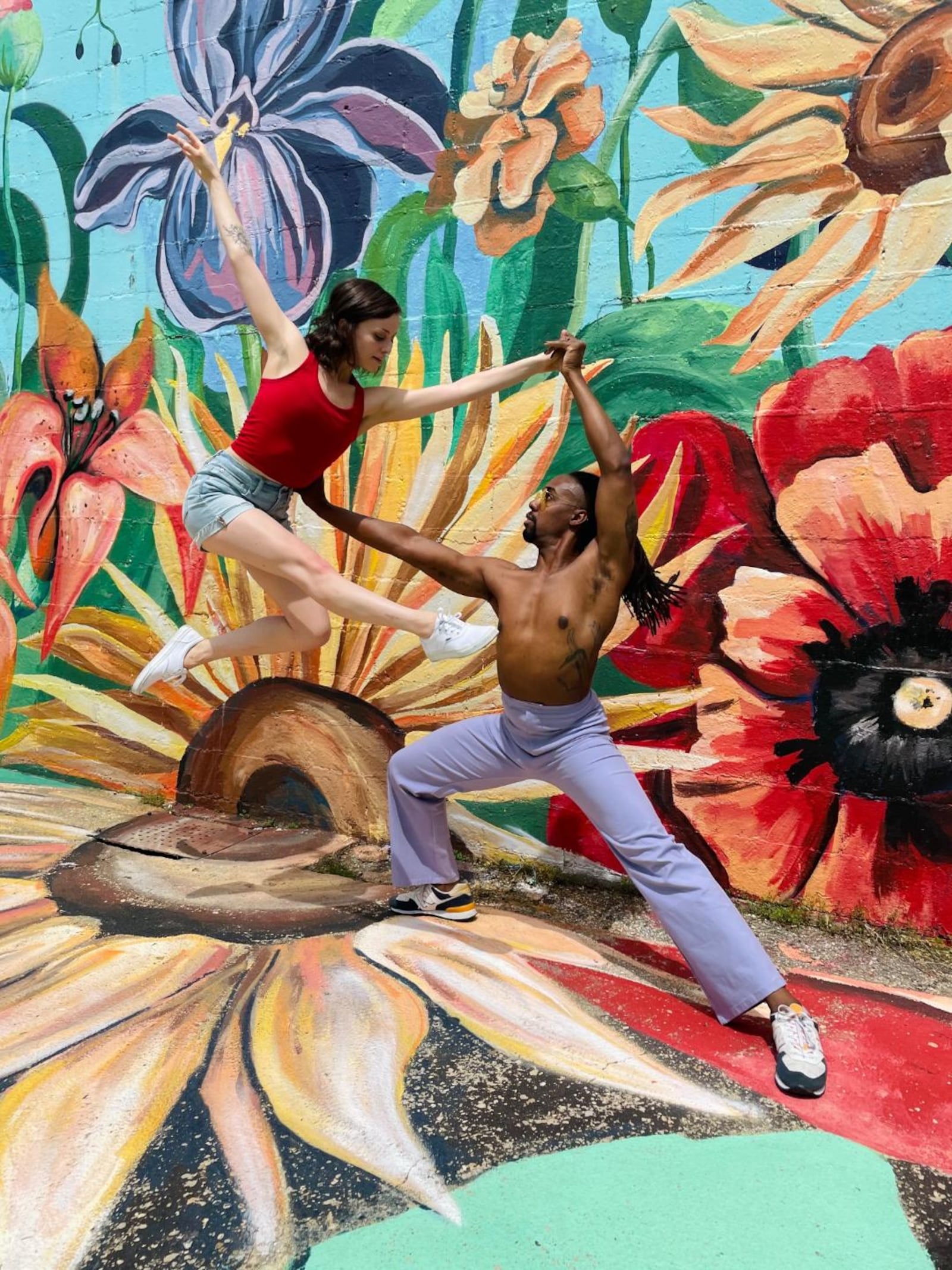 Dayton Dance Initiative company members Margot Aknin and Quentin Sledge. CONTRIBUTED/MURAL BY TIFFANY CLARK.