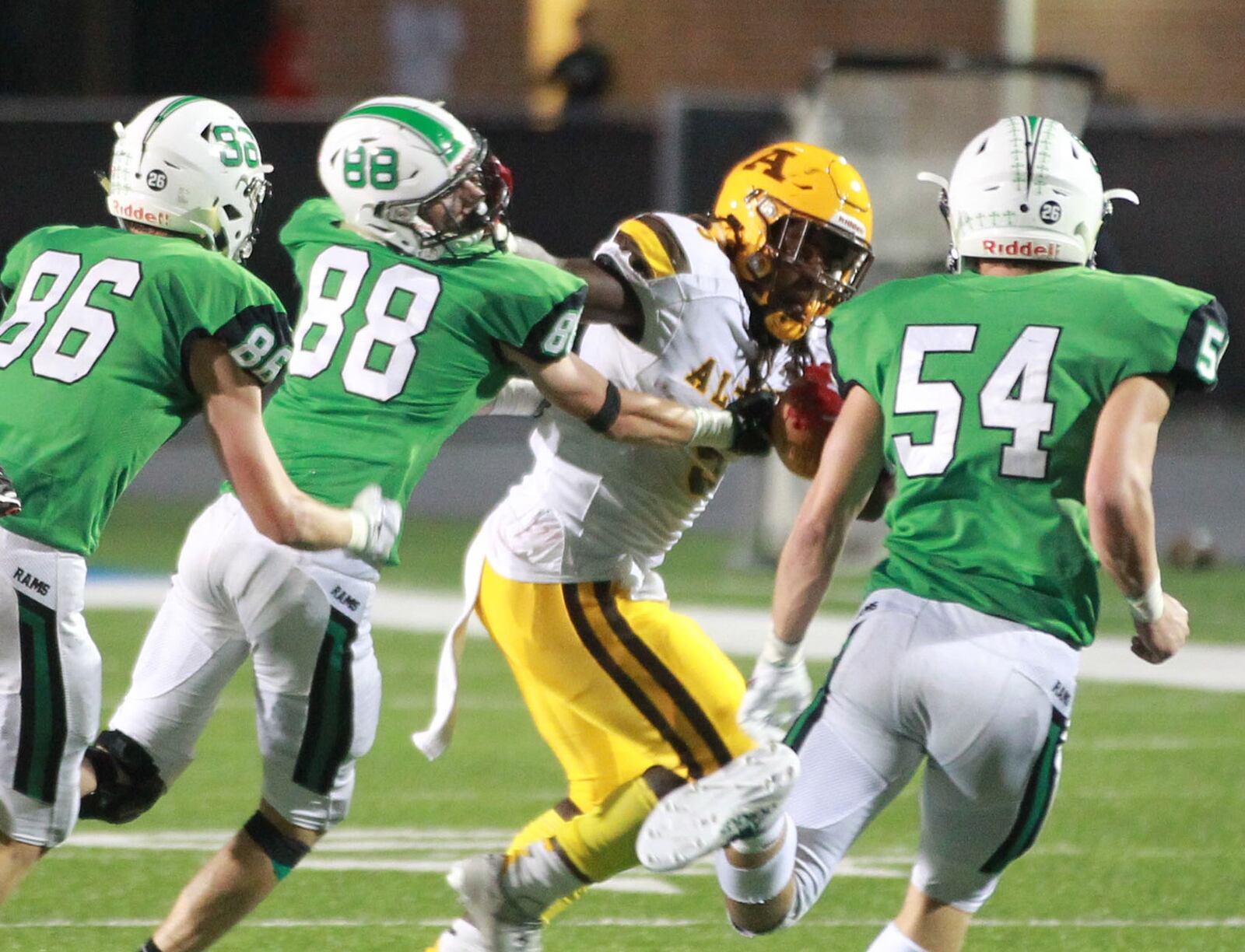 Badin defenders David Schweinefuss (86), Michael Schweinefuss (88) and Evan Schlensker (54) helped knock Knights running back Branden McDonald and Alter out of the D-III top 10. MARC PENDLETON / STAFF