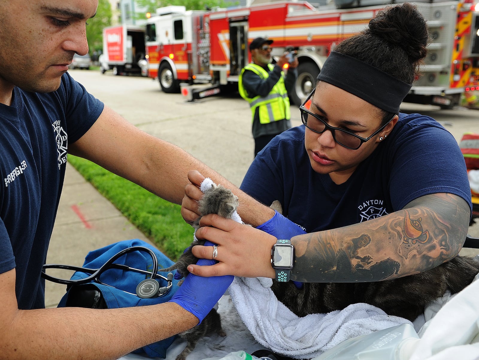 Members of the Dayton Fire Department rescued four cats from a house fire on Mound Street Friday afternoon May 6, 2022. One cat did not survive, but three others did including two kittens that were given oxygen by paramedics. No one was home at the time of the fire. MARSHALL GORBY\STAFF