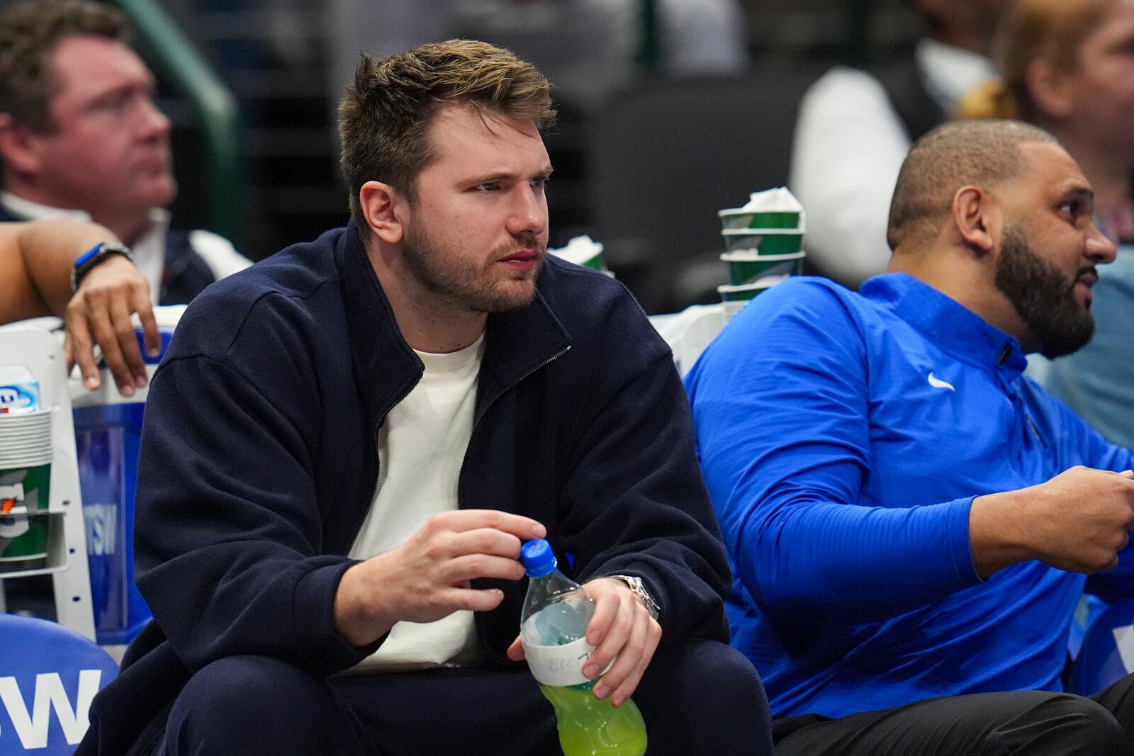 Dallas Mavericks guard Luka Doncic looks on from the bench during the second half of an NBA basketball game against the Denver Nuggets, Sunday, Jan. 12, 2025, in Dallas. The Nuggets won 112-101. (AP Photo/Julio Cortez)